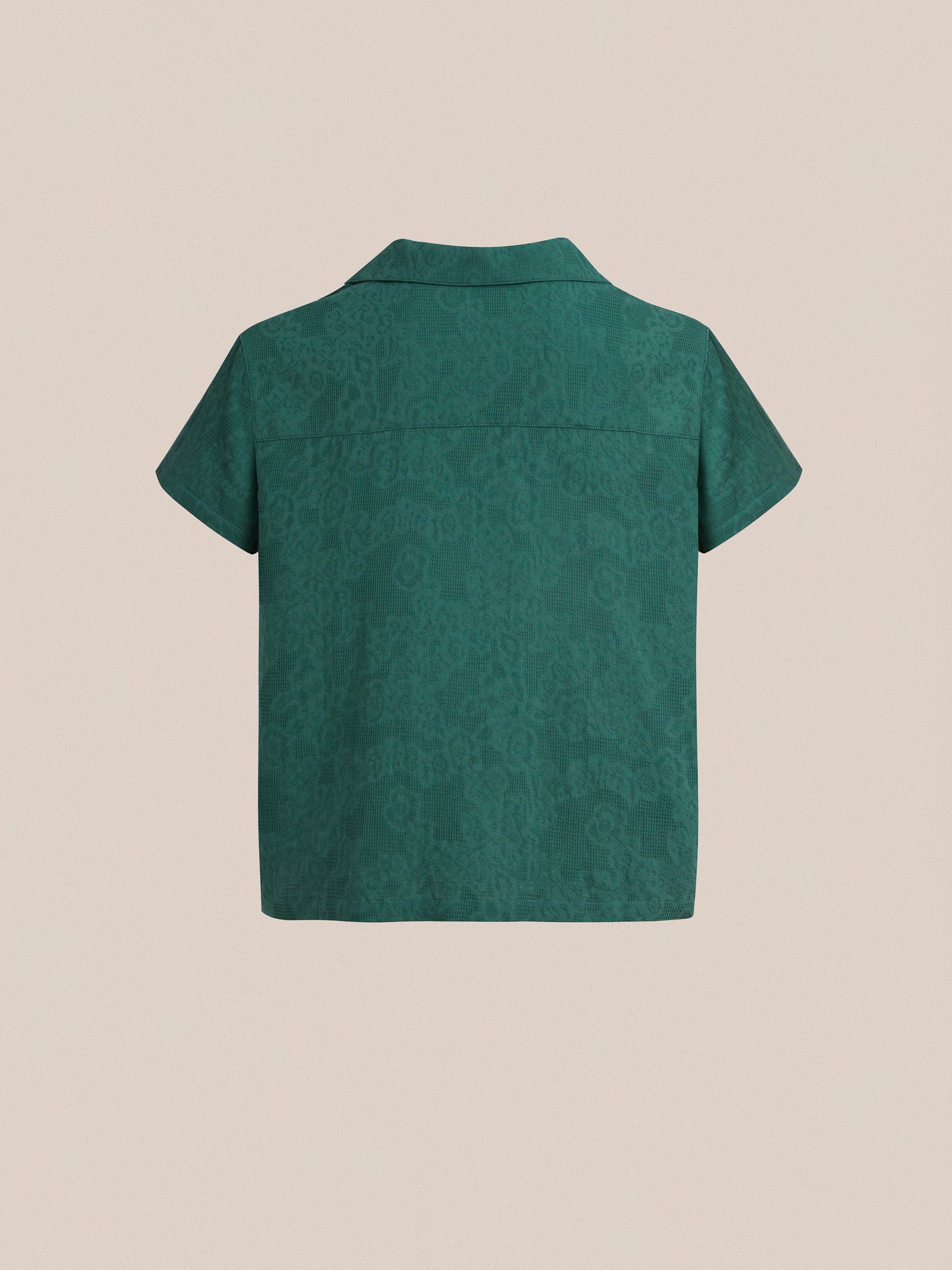 The back view of a green Found Mount Camp Shirt with a short sleeve and lace detailing.