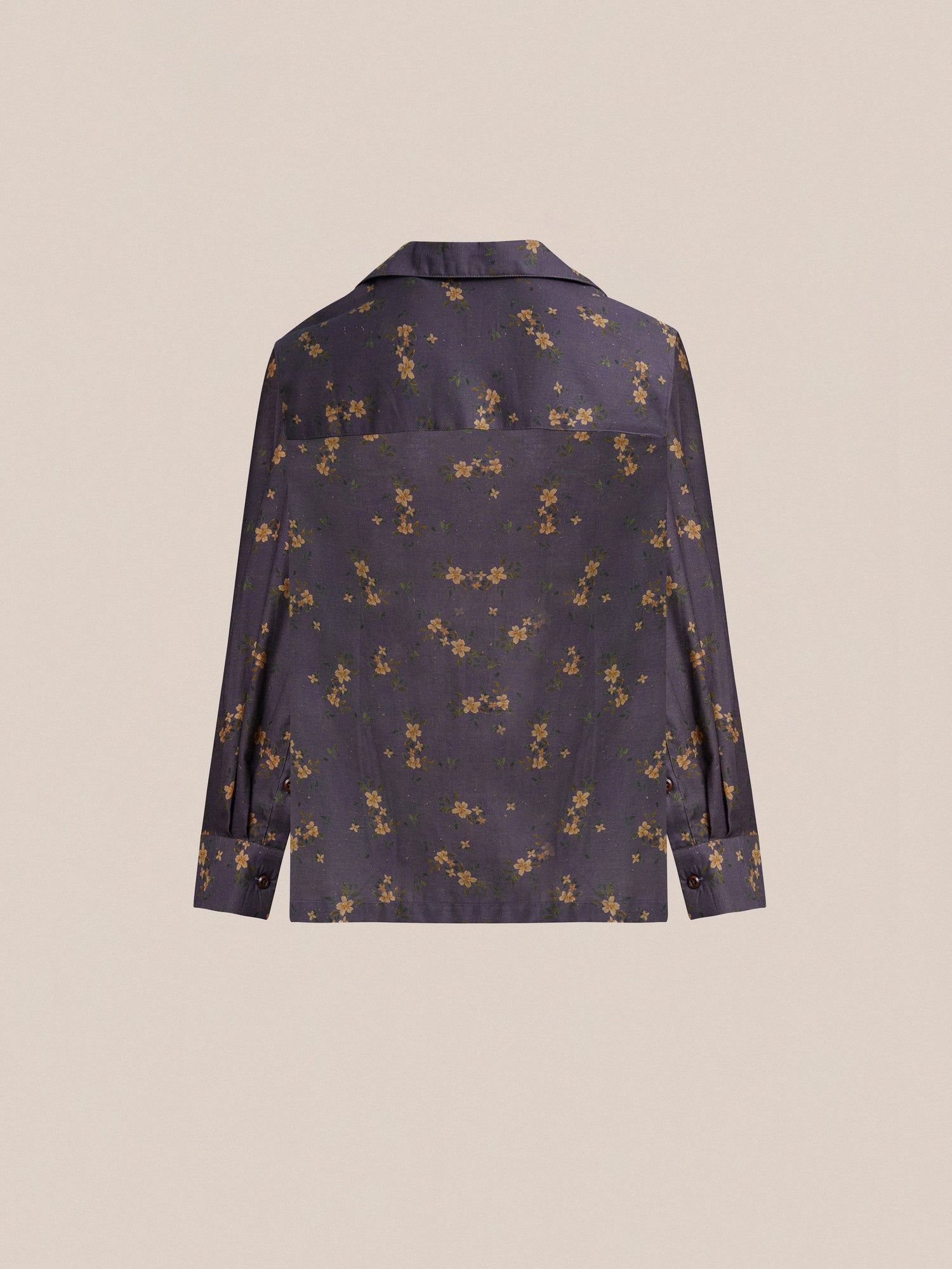 The back of a Found Dusty LS Camp Shirt with a floral print on it, exuding classic appeal.