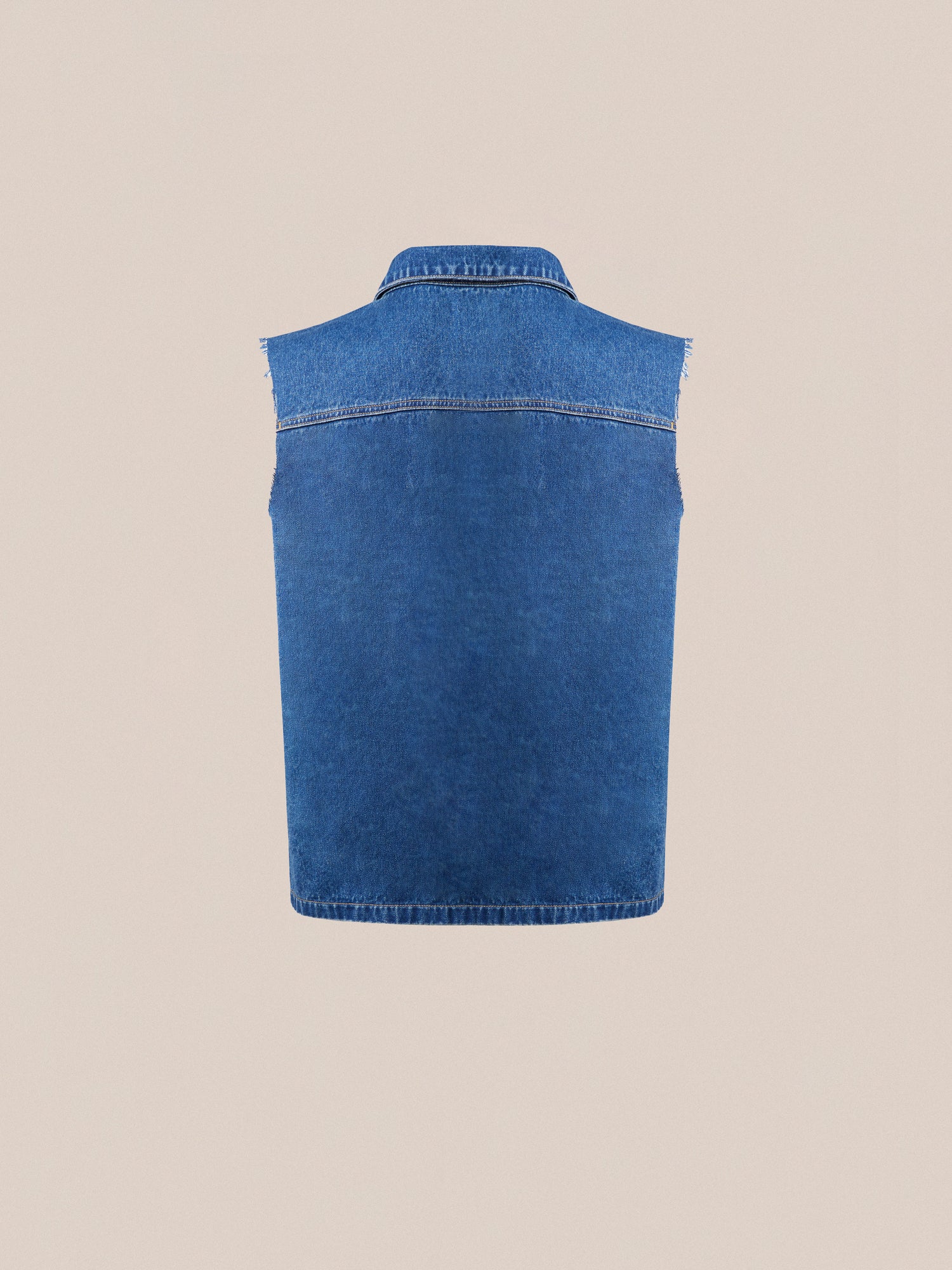 A vintage-inspired, sleeveless Raw Cut Patch Mechanic Denim Vest by Found displayed against a plain beige background.