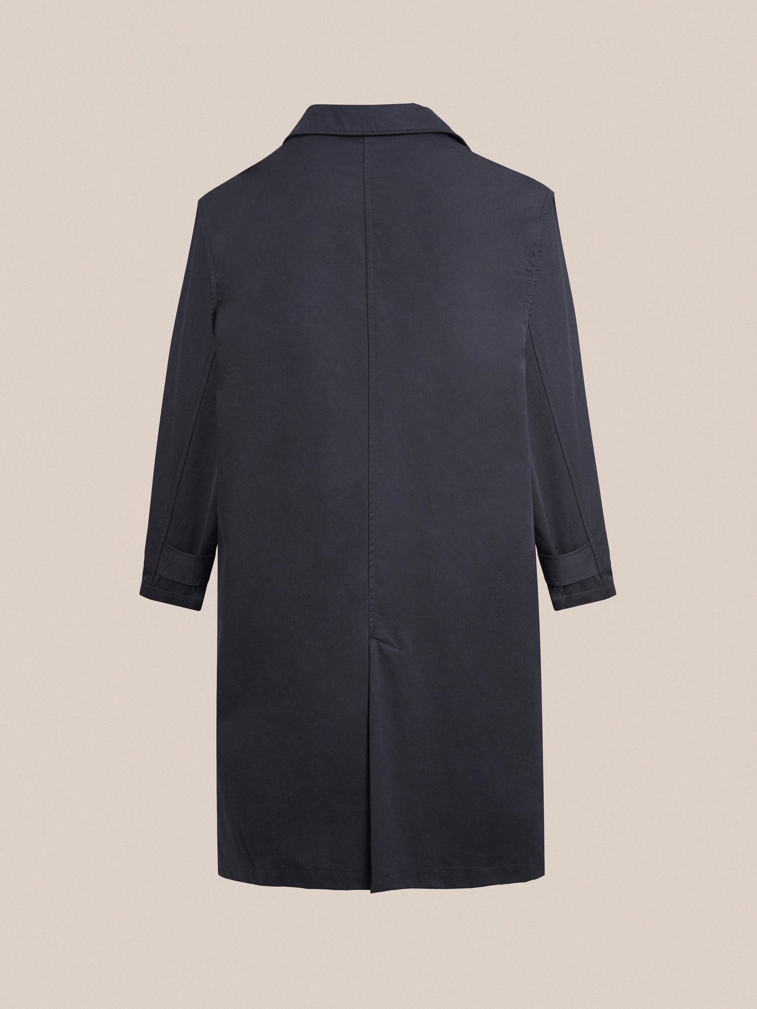 The back view of a Found Naval Trench Coat in navy, crafted from premium materials.