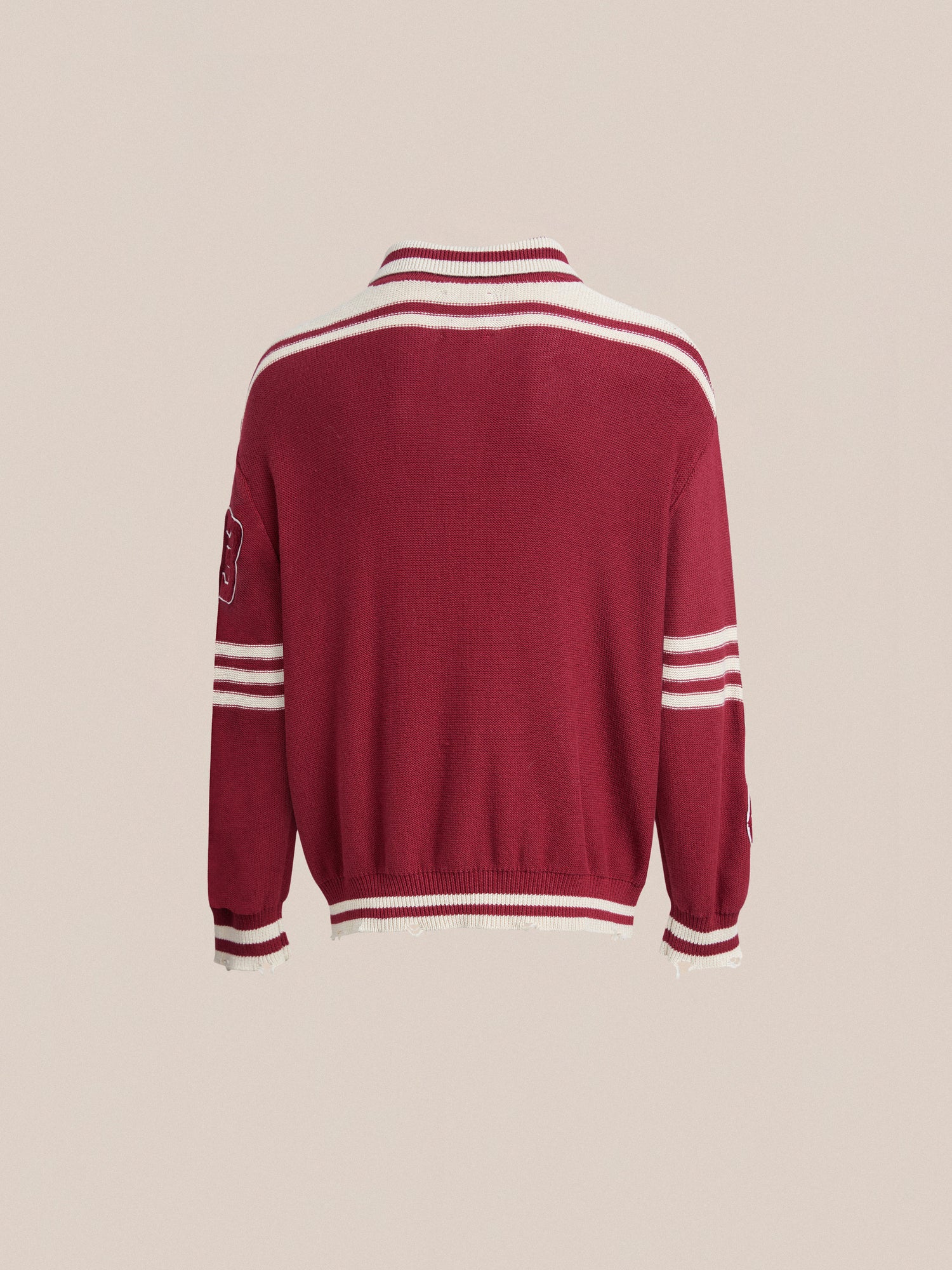 The back of a red sweater with white stripes features a Found Fin Varsity Patch Collared Cardigan.