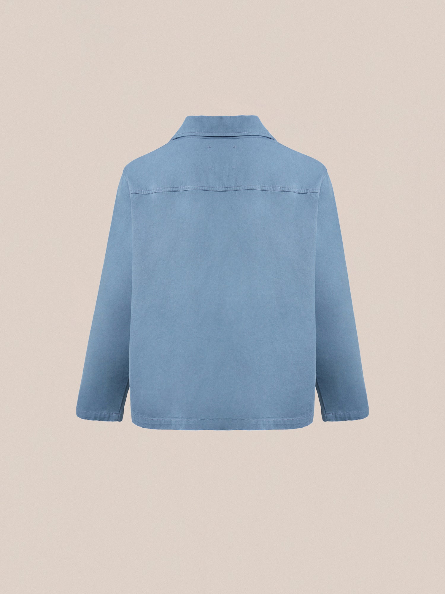 The back view of a vintage workwear-inspired durable blue denim Found Patina Work Jacket.