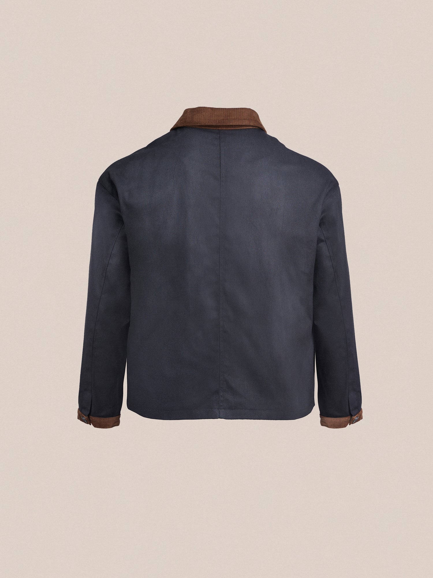 The back view of a blue Lar Waxed Cotton Box Coat with brown detailing by Found.