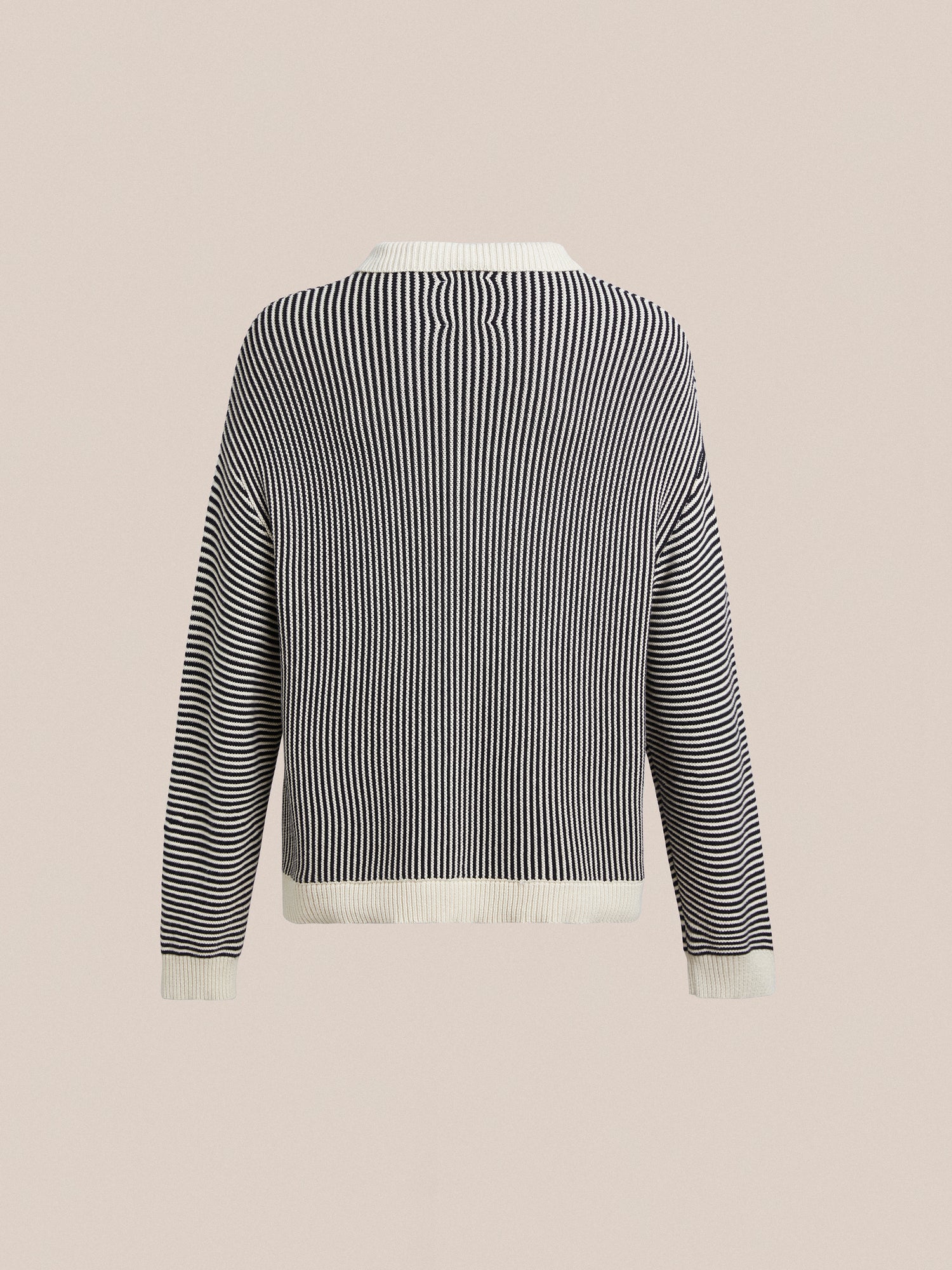 A women's Tabas Tie Knit Collared Sweater in black and white with intricate knit patterns by Found.