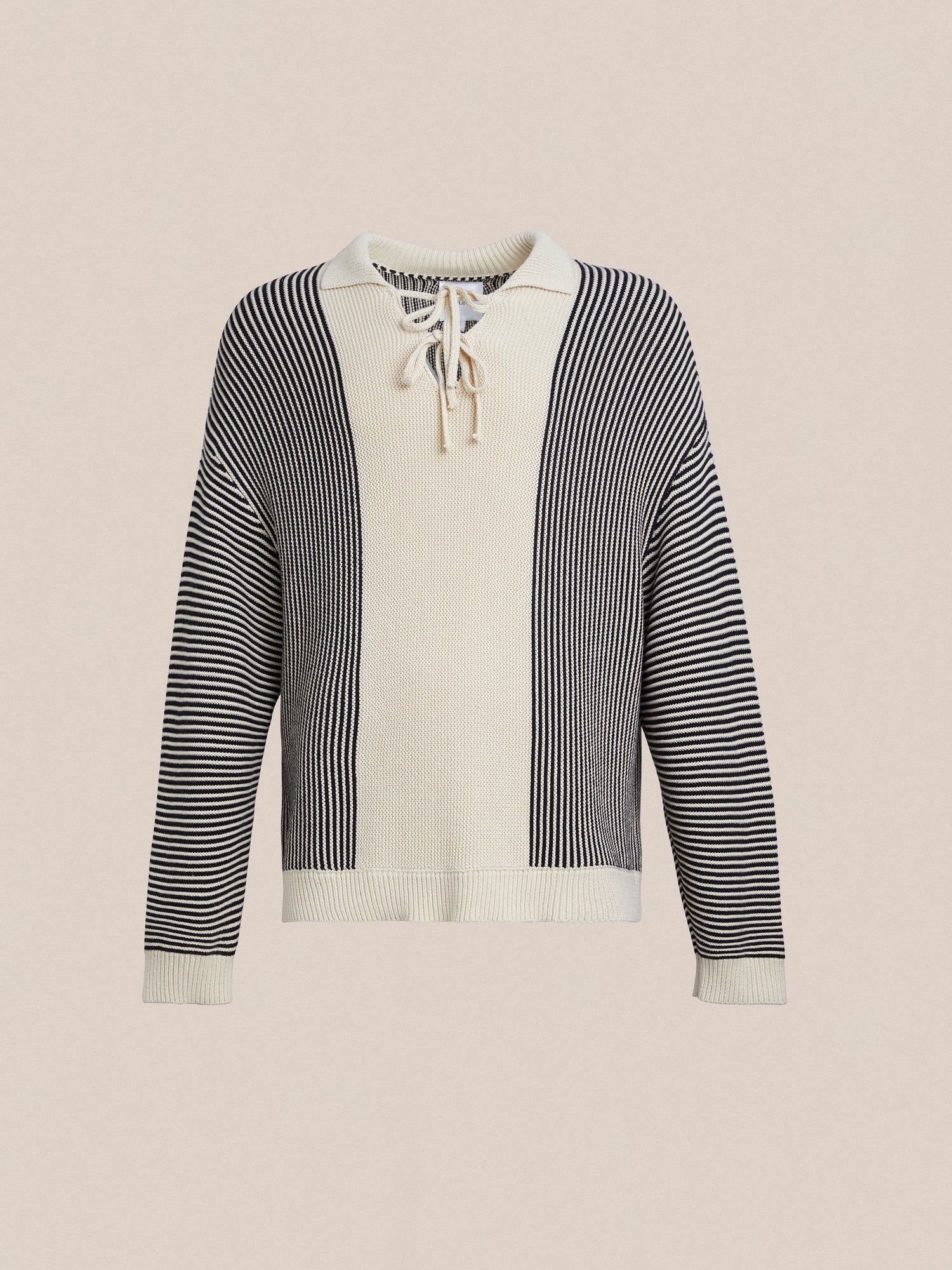 A white and black Found Tabas Tie Knit Collared Sweater with a striped pattern and intricate knit patterns.