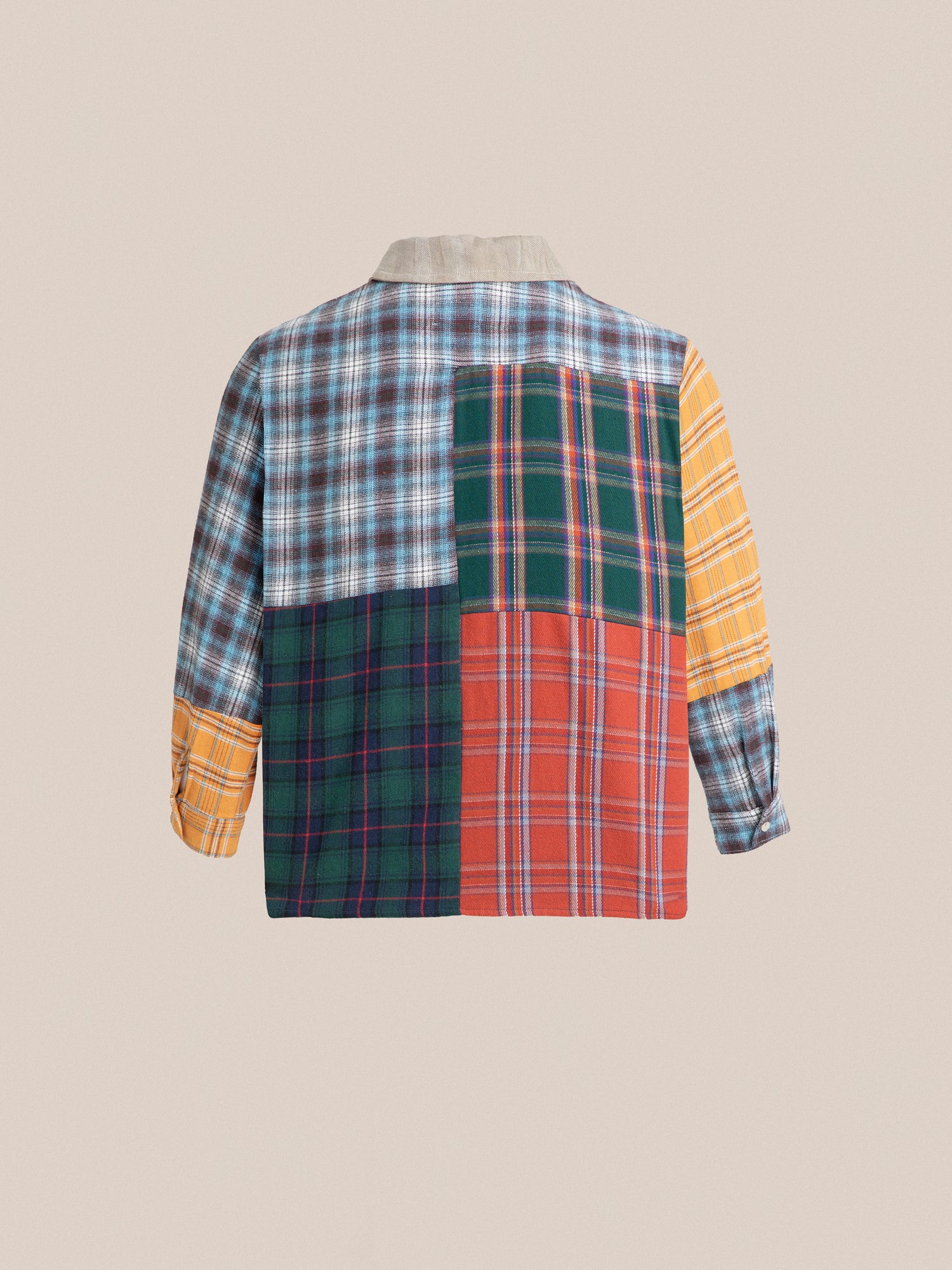A zip-up Multi Plaid Tartan shirt with a patchwork pattern by Found.