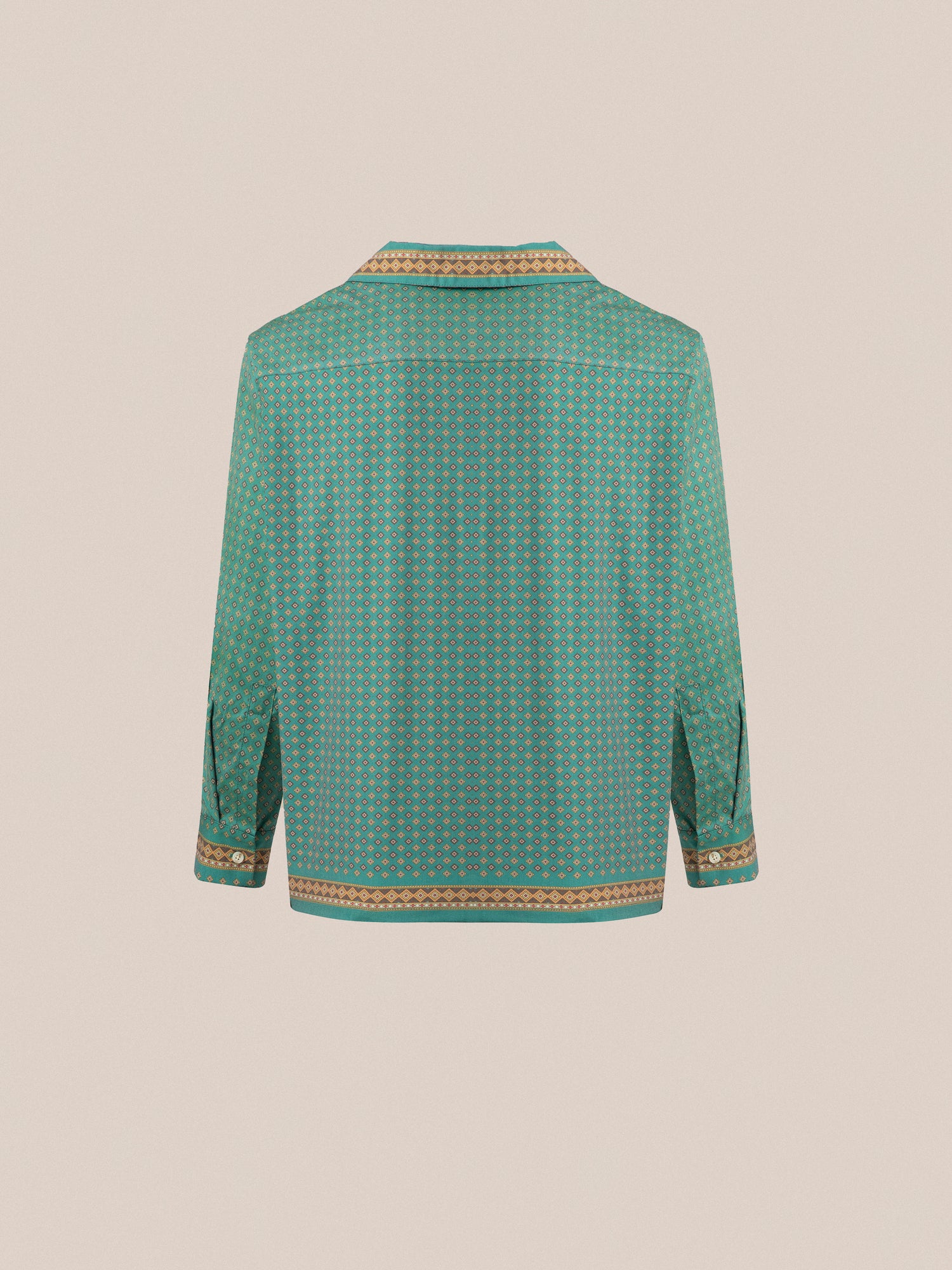 The back view of a green Found Arbor Long Sleeve Camp Shirt with traditional indo patterns and double breast pockets.