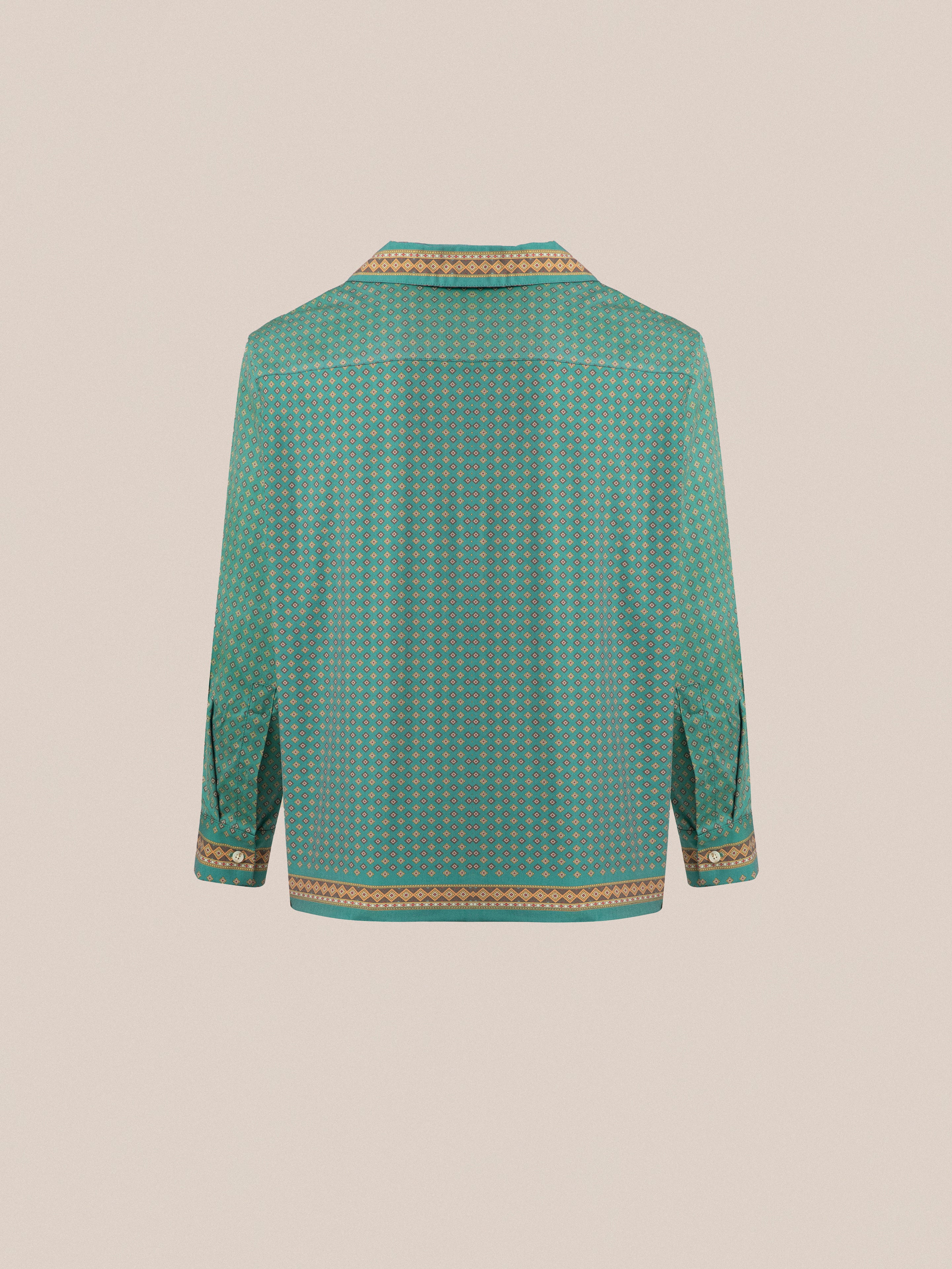 The back view of a green Found Arbor Long Sleeve Camp Shirt with traditional indo patterns and double breast pockets.