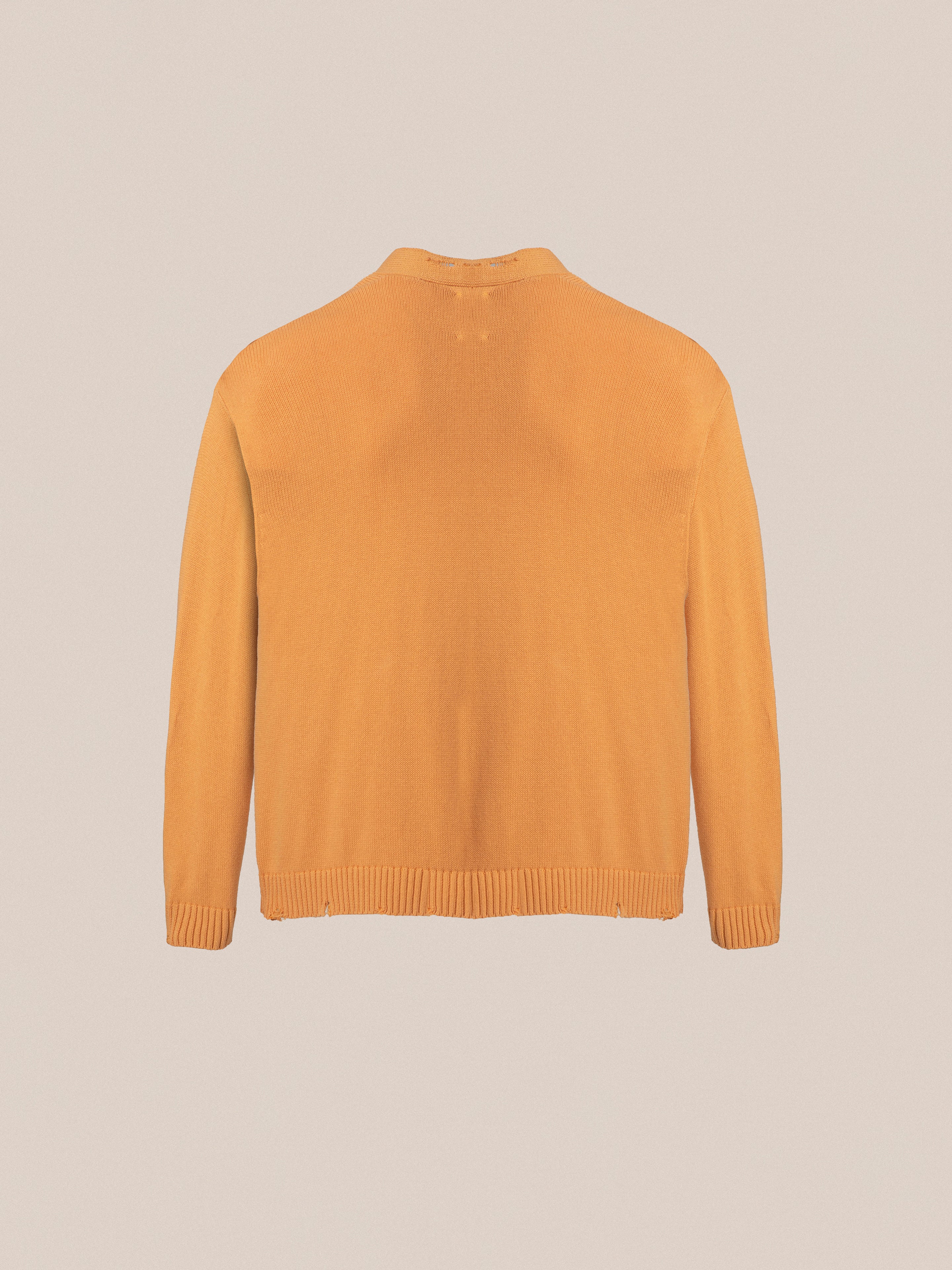 The back view of a Found Cadmium Distressed Cardigan.