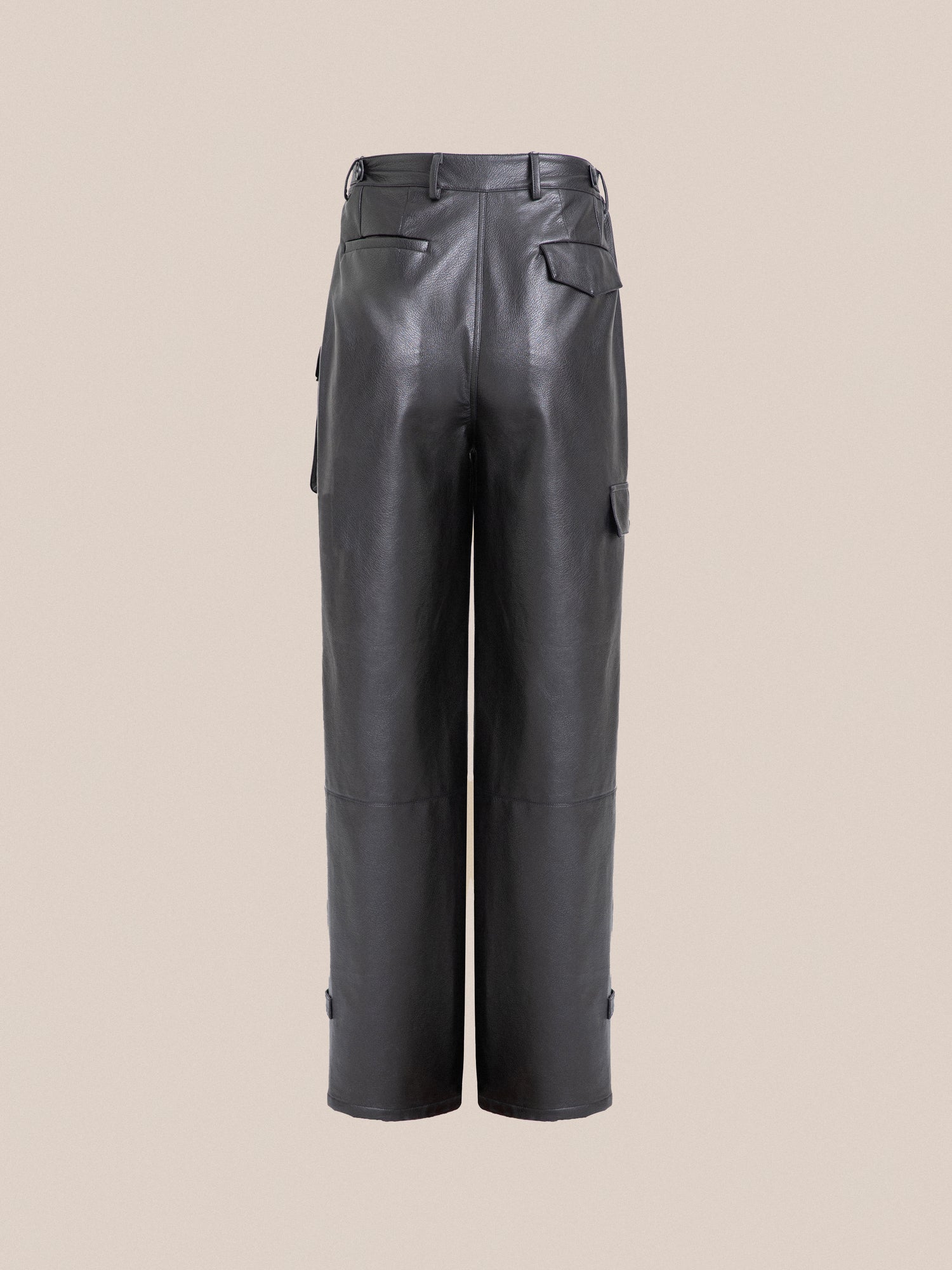 A pair of black Found faux leather cargo pants with cargo pockets.