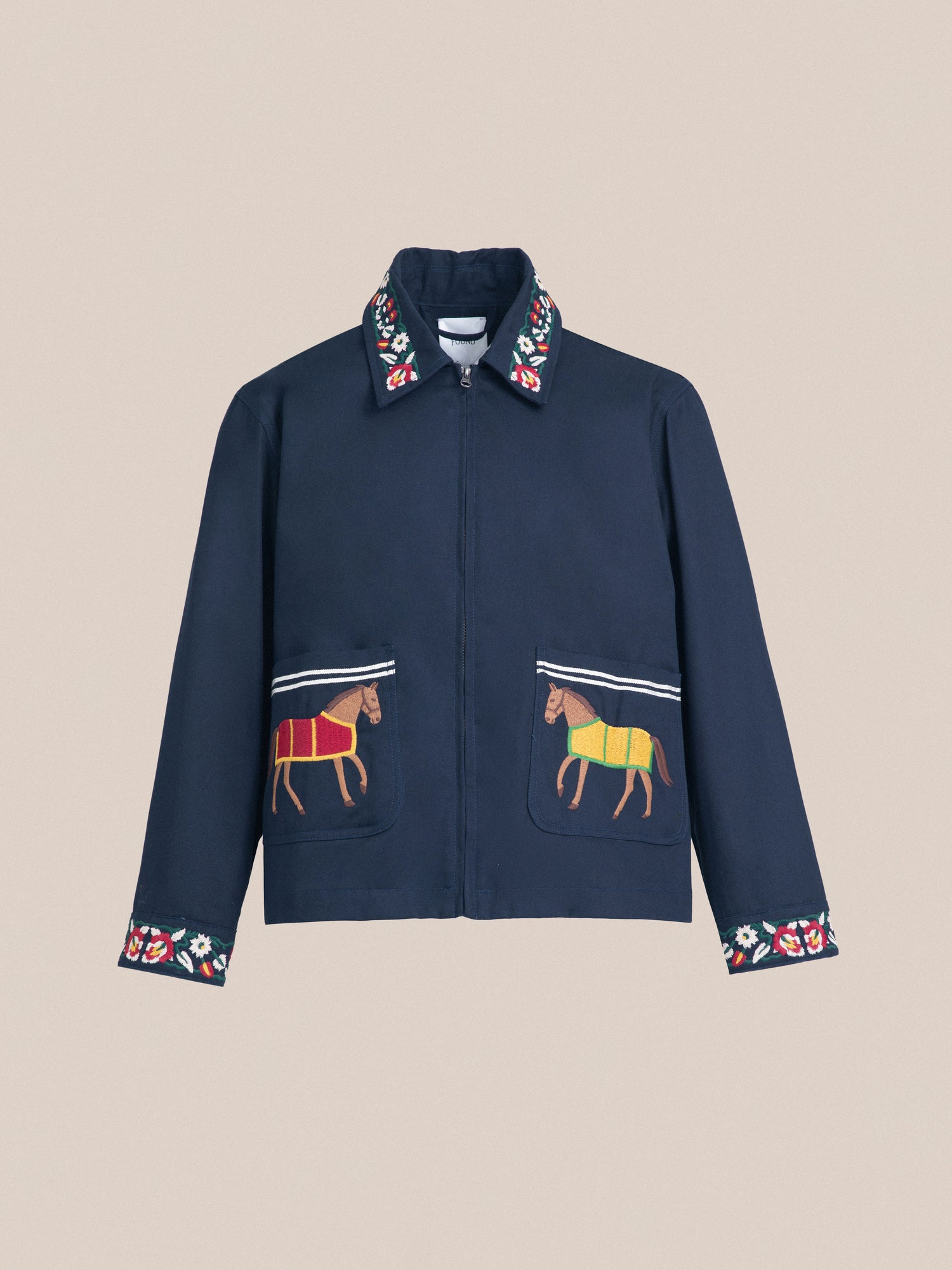 A blue Found Horse Equine Work Jacket with embroidered horses on it, inspired by jockey uniforms.
