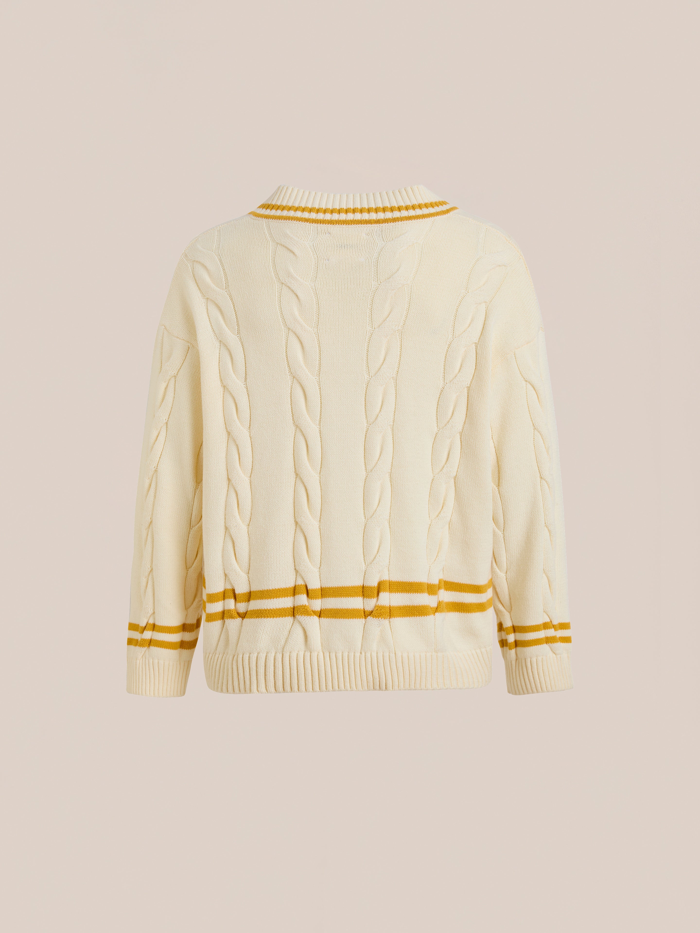 FOUND V-Neck Cricket Sweater in beige, featuring yellow and brown stripes on cuffs, hem, and collar. Shown from the back against a plain background, this unisex sweater offers a classic look with a sporty twist.