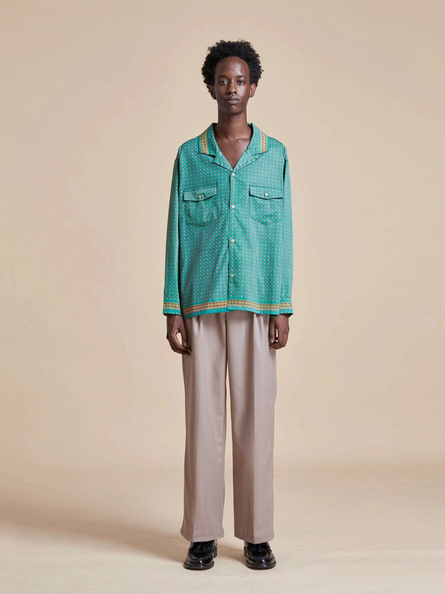 The model is wearing a green Found Arbor Long Sleeve Camp Shirt.