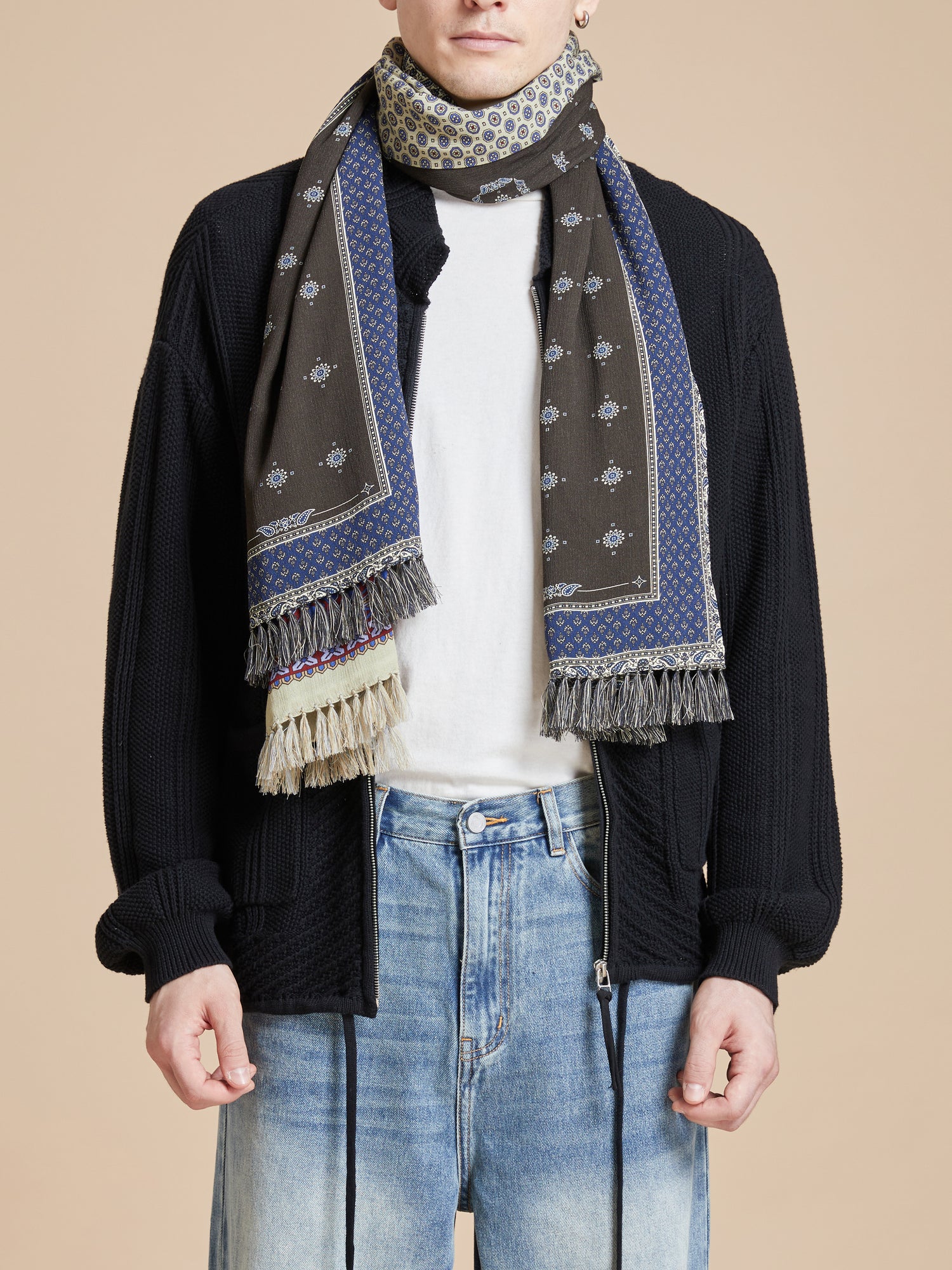 A man wearing jeans and a Black Royal Blue Print Scarf by Found.
