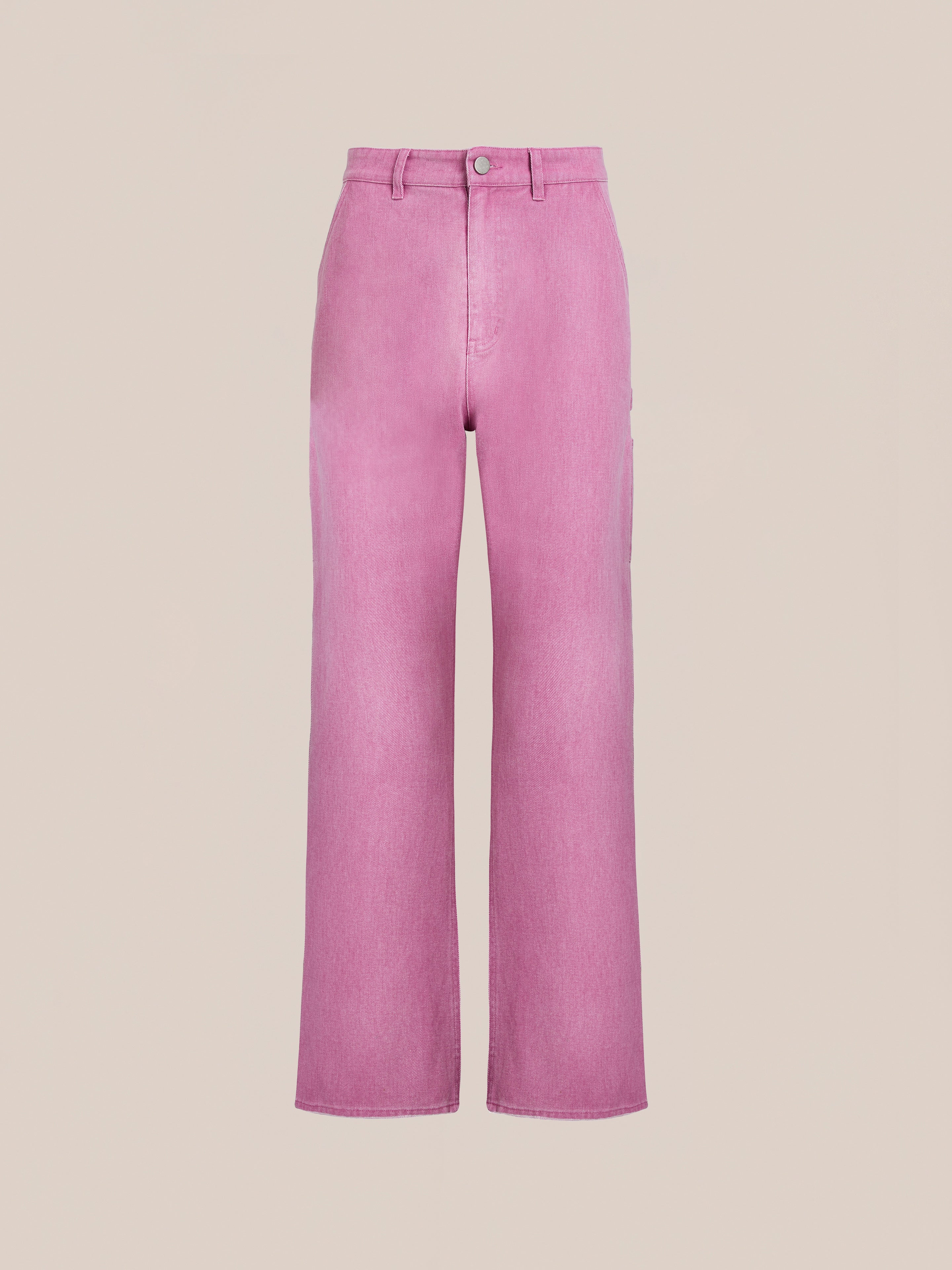 The FOUND Flare Work Pants are high-waisted, straight-leg pink unisex trousers with front button and zip closure, shown against a plain beige background.