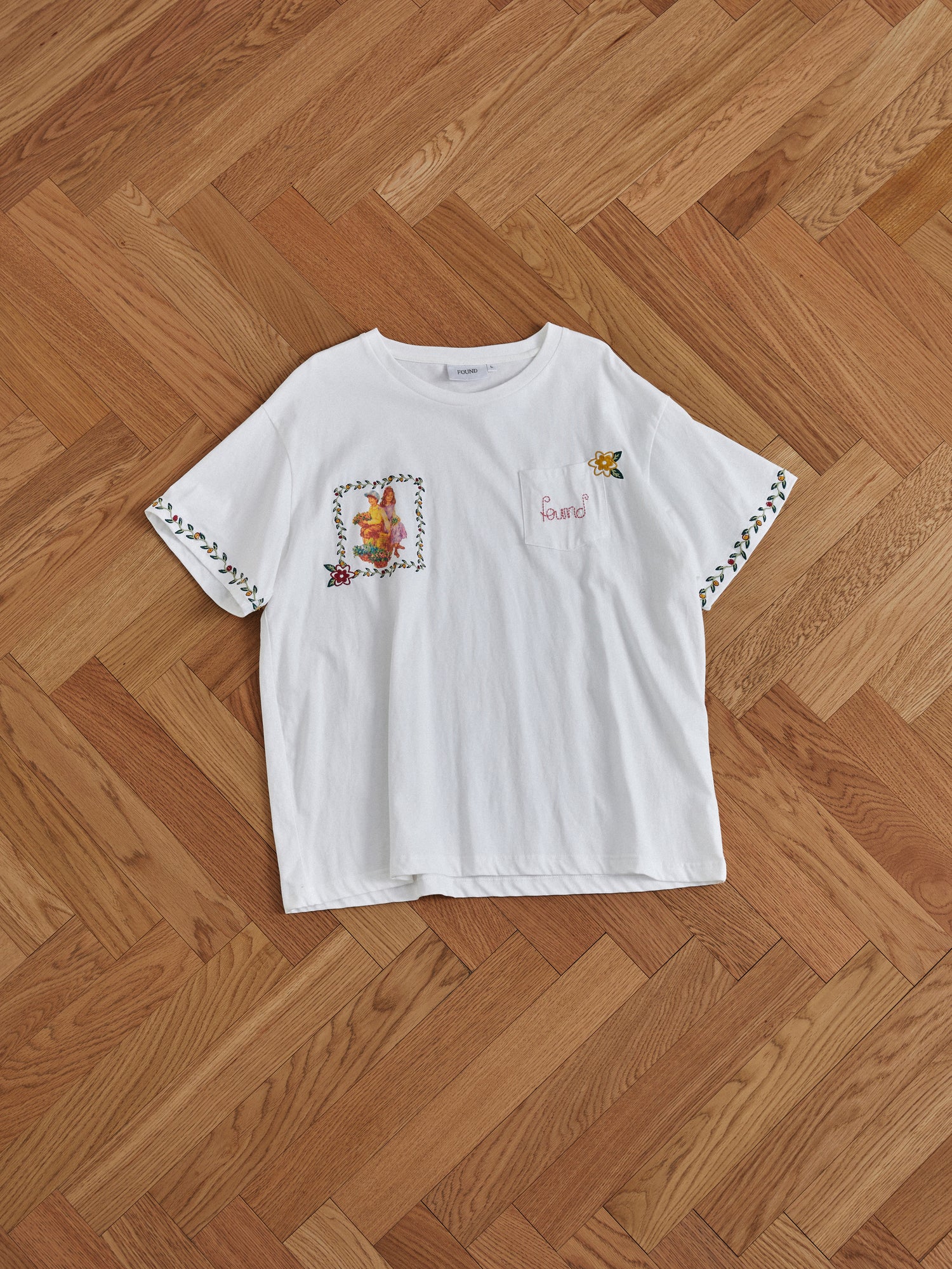 A Flower Children Tee with embroidered flowers inspired by Phulkari style embroideries, by Found.