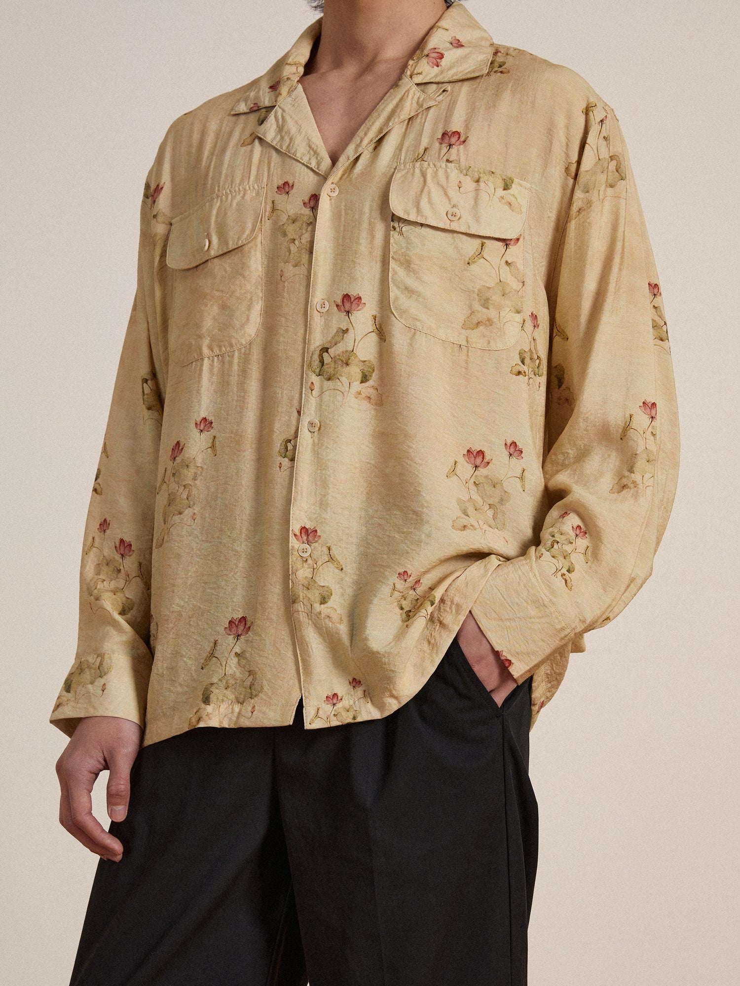 The model is wearing a Found Lotus LS Camp Shirt with floral print.