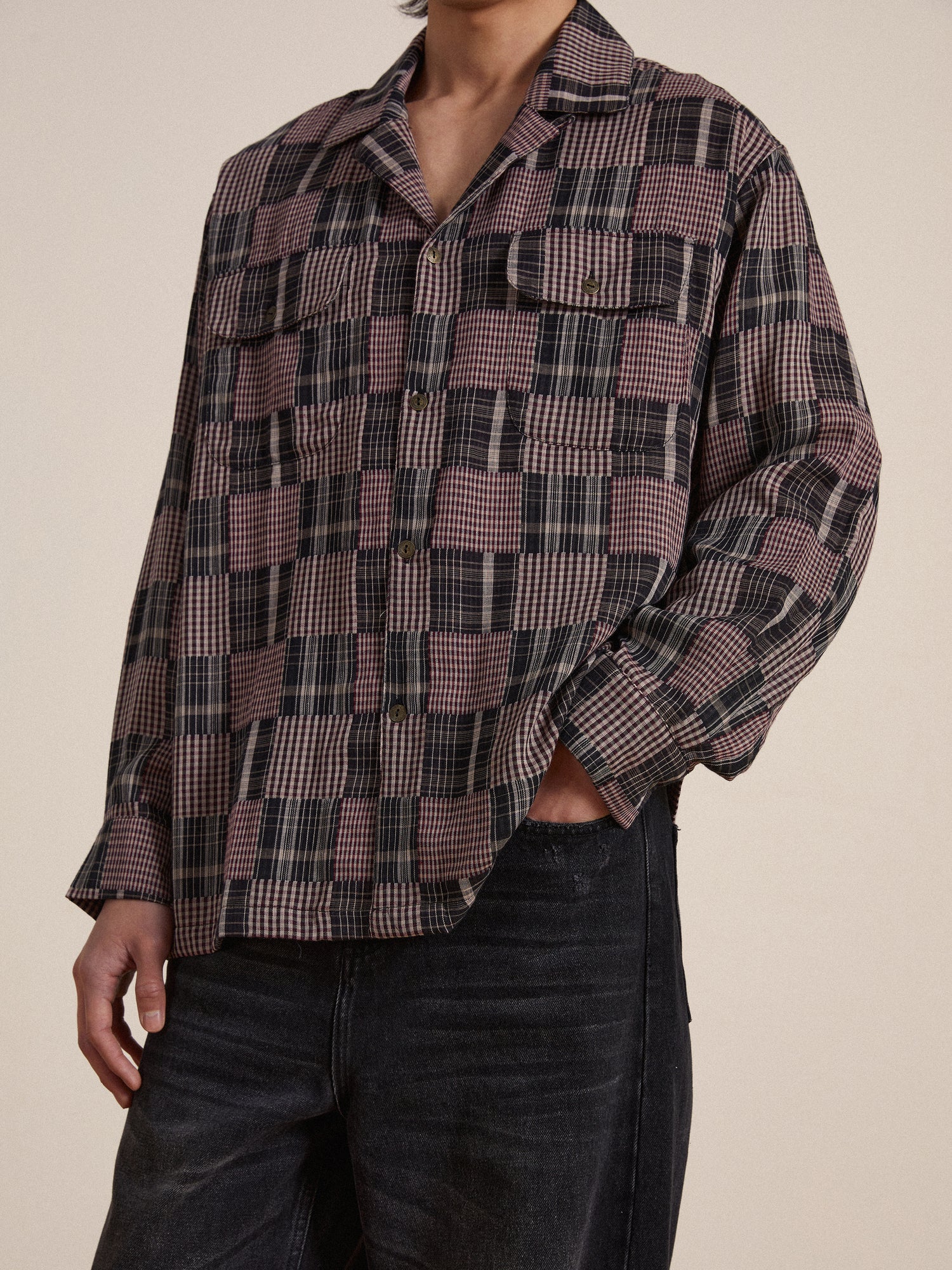 A man wearing a Found Multi-Flannel LS Camp Shirt and jeans.