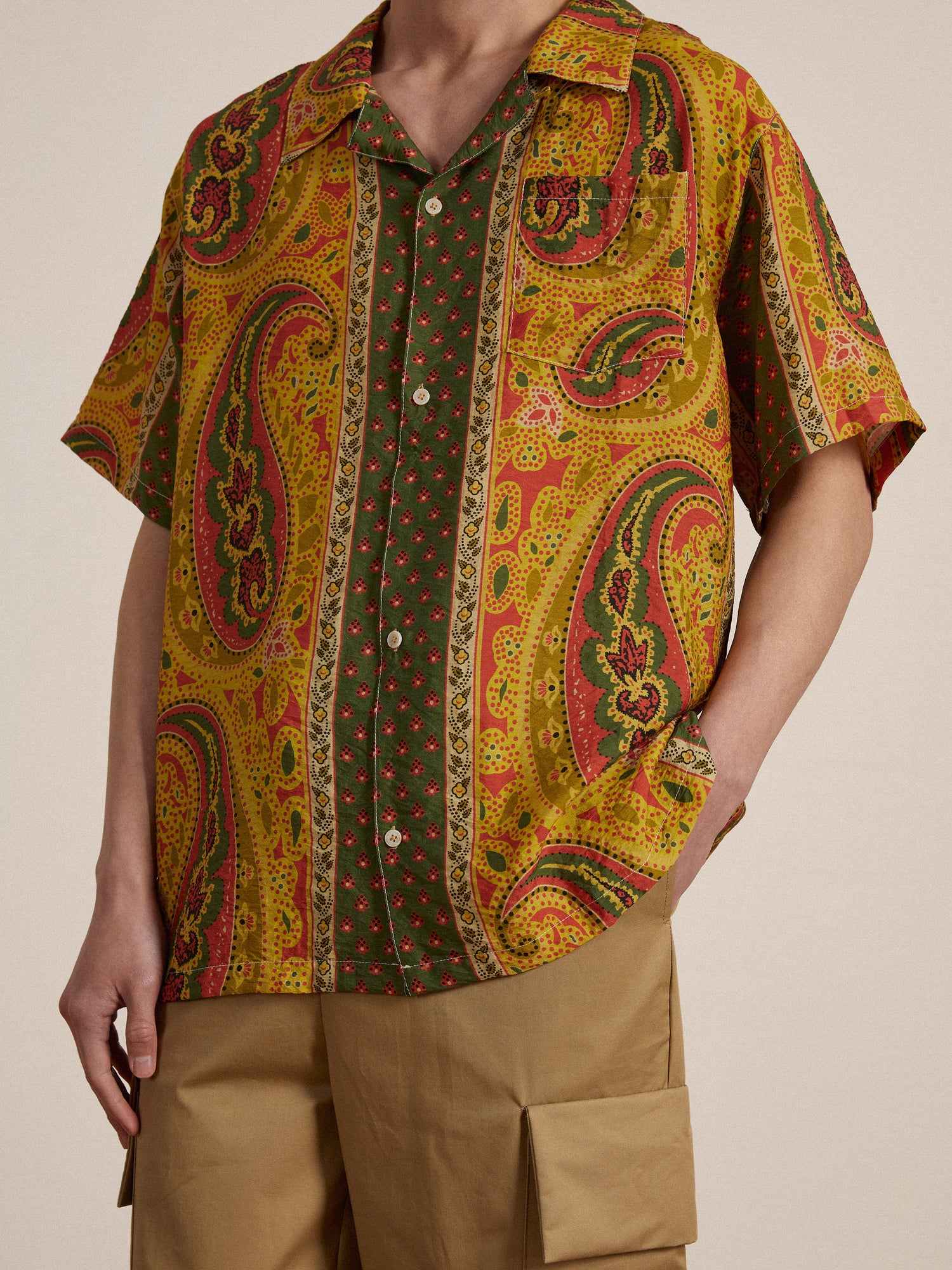 A man wearing a Found Pench Paisley SS Camp Shirt.