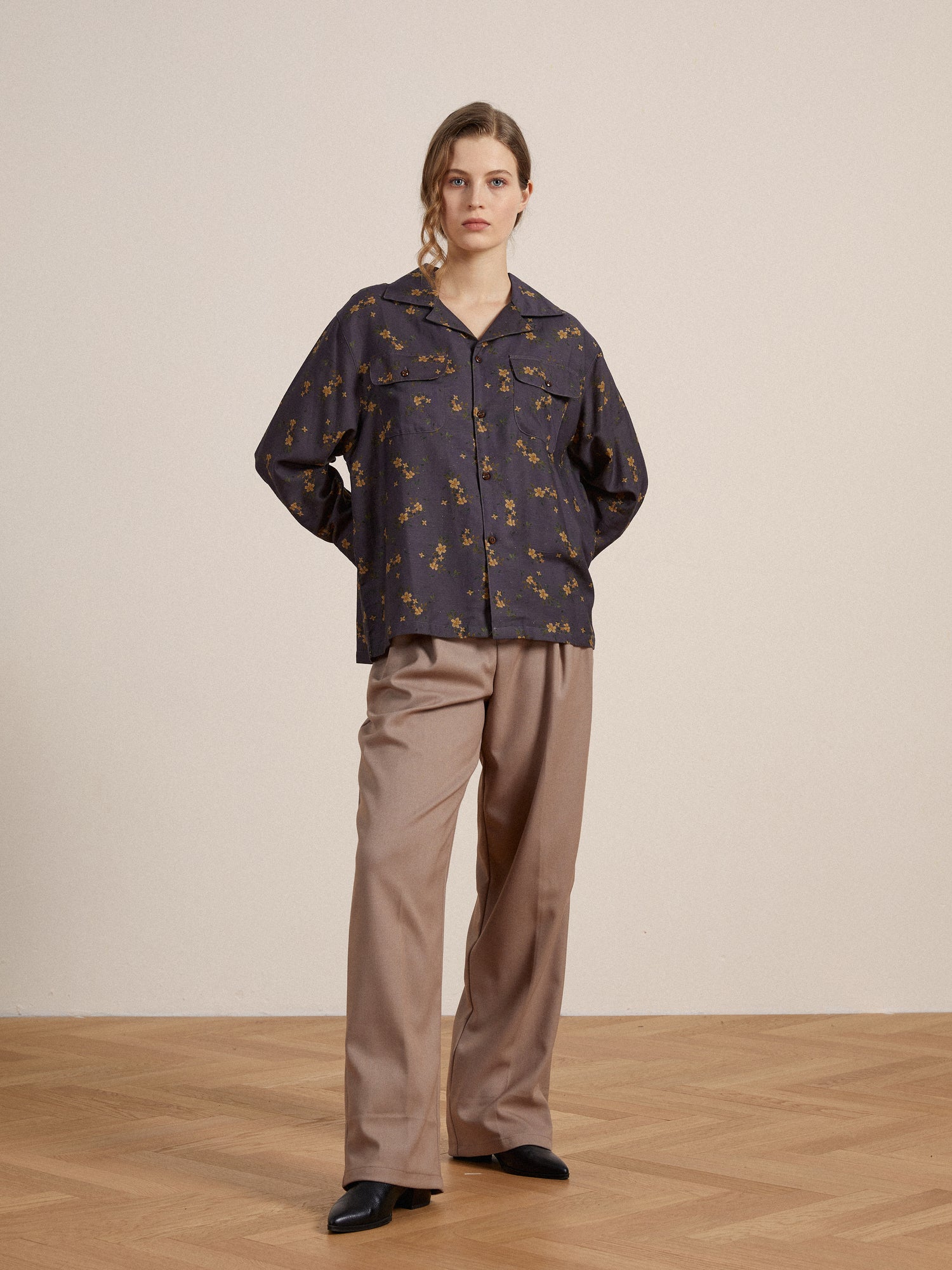 The model is wearing a Found Dusty LS Camp Shirt and tan trousers.