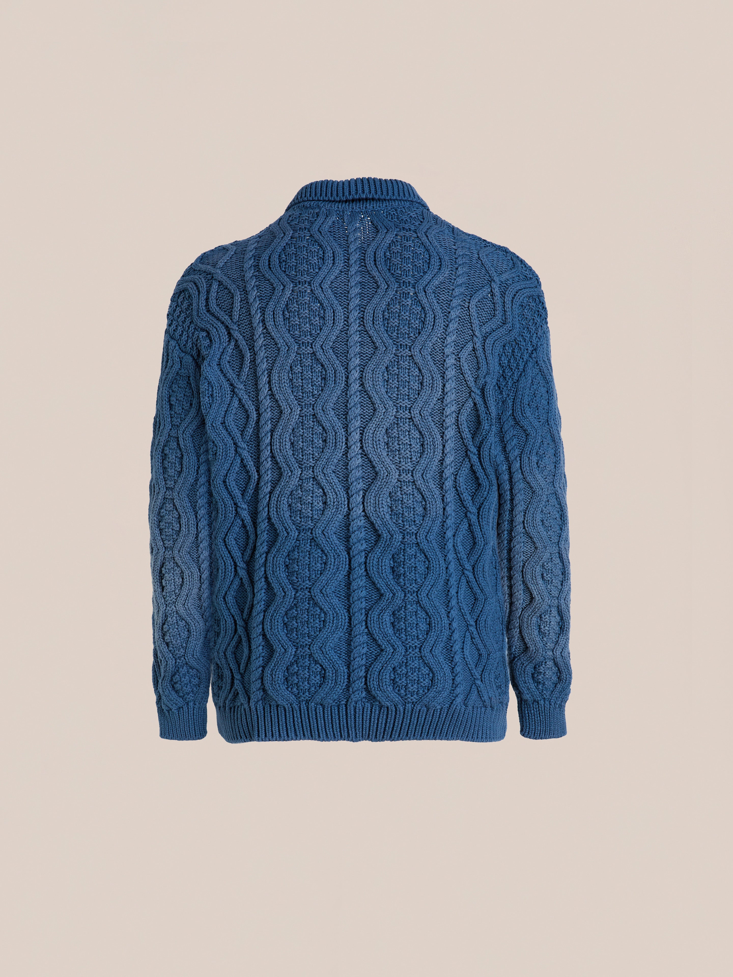 Found Cable Knit Buttoned Cardigan shown from the back against a plain beige background.