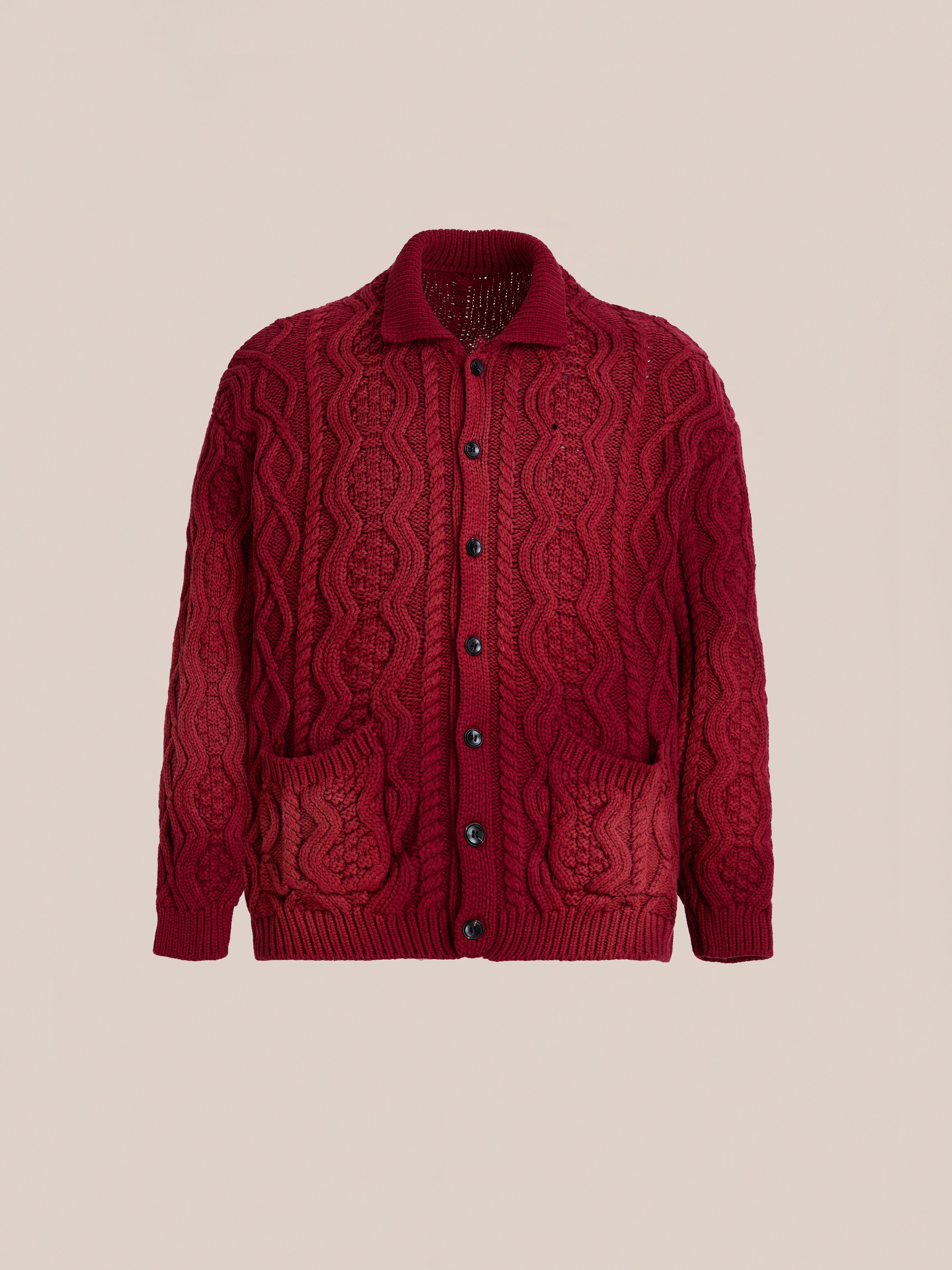 The FOUND Cable Knit Buttoned Cardigan, featuring a chunky red knit with a collar, front buttons, and two pockets, is shown against a plain background.