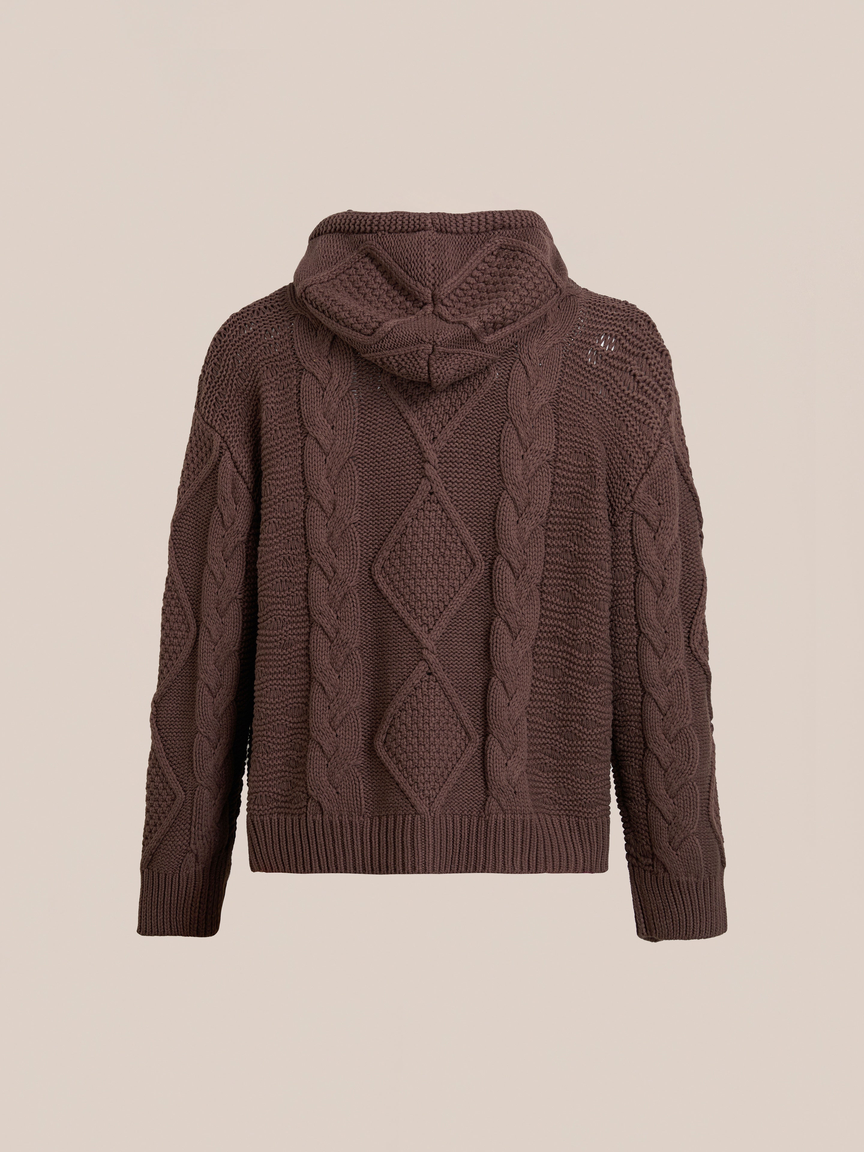 The FOUND Zip Up Cable Knit Hoodie is a vintage-inspired, unisex piece in brown, featuring diamond and braided patterns on the back.