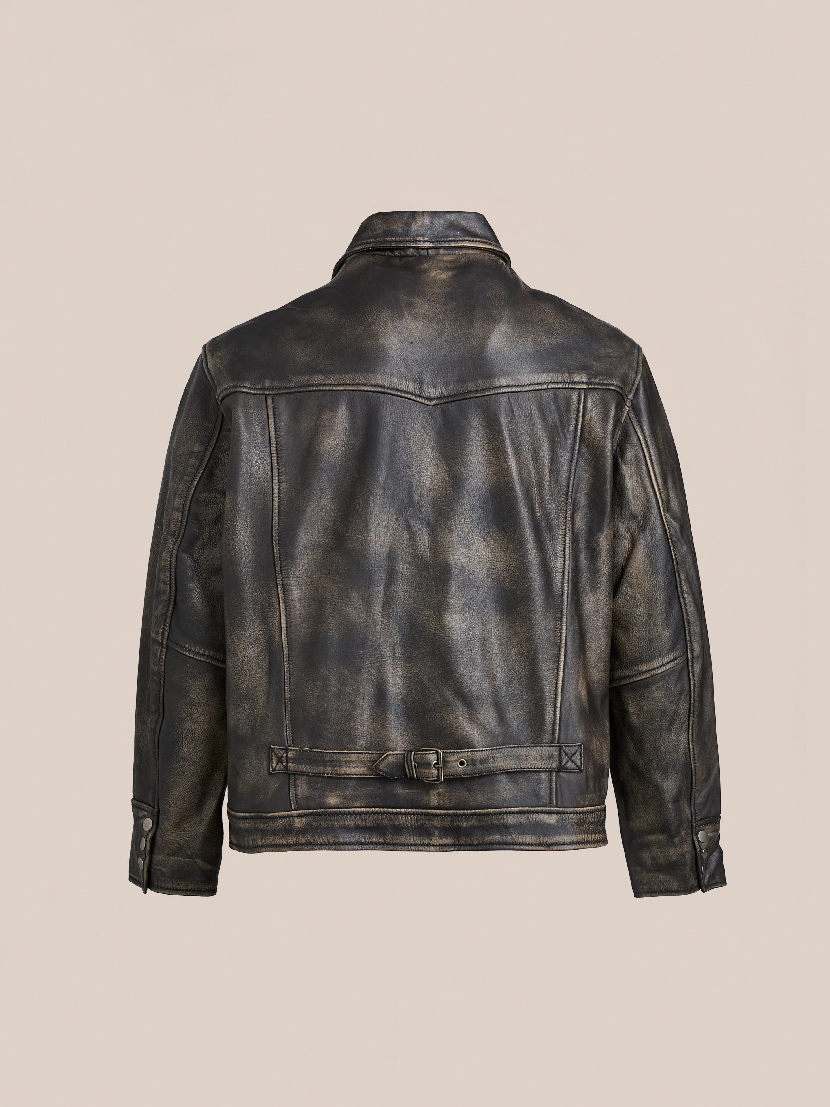 The Found Distressed Leather Pocket Jacket, crafted from genuine distressed black leather cowhide, is shown from the back with a waist belt and buttoned cuffs against a plain beige background.