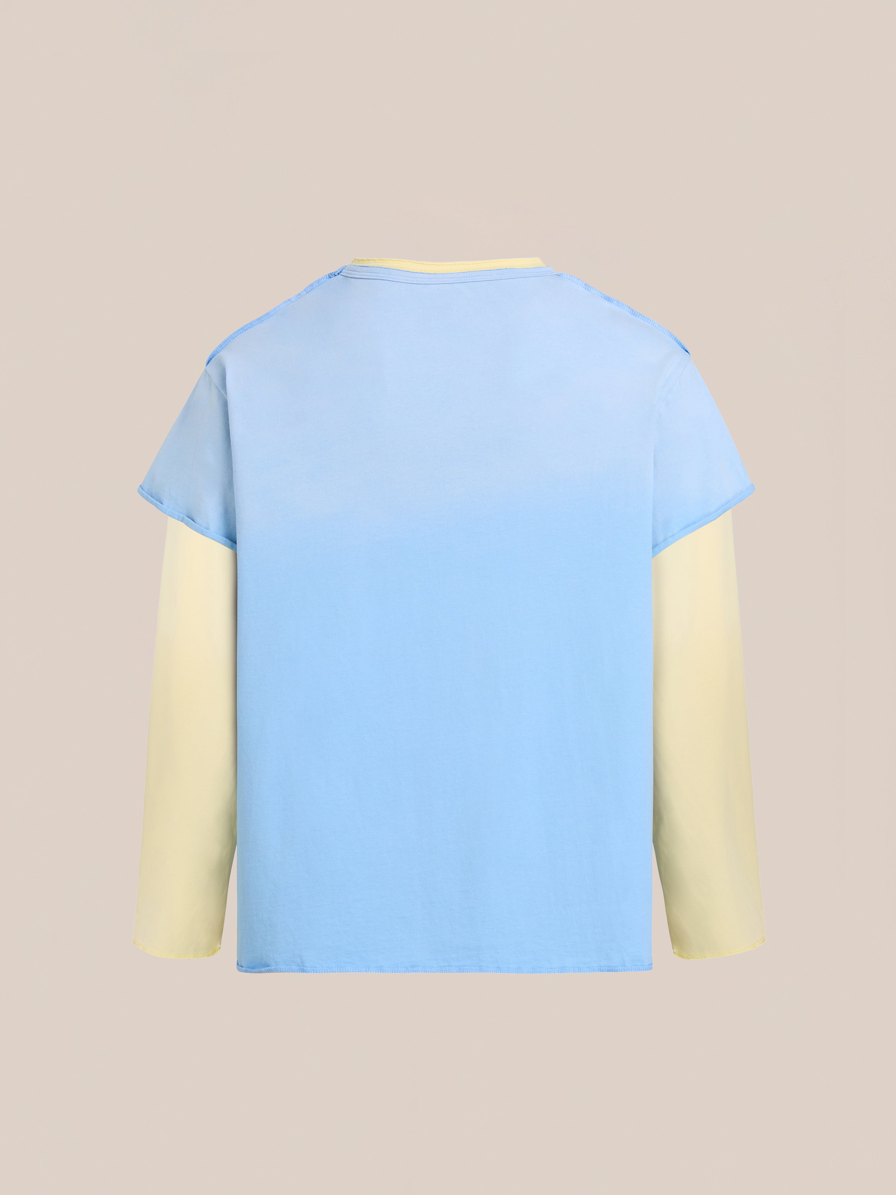 The FOUND Double Layer LS Tee features light yellow sleeves and a sunfade wash light blue body, shown against a plain beige background.