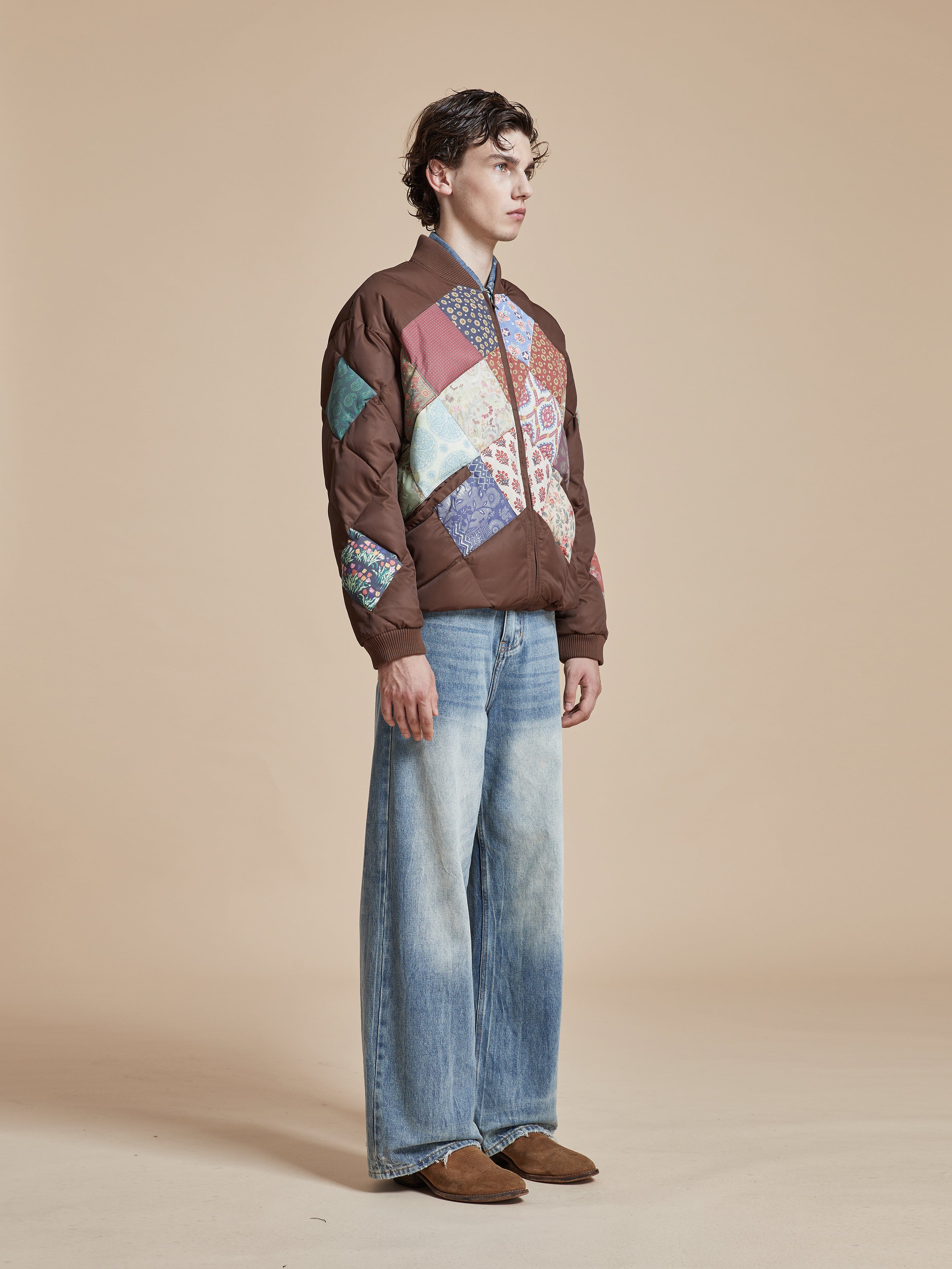 A model wearing a Found Diamond Quilt Patchwork Jacket.