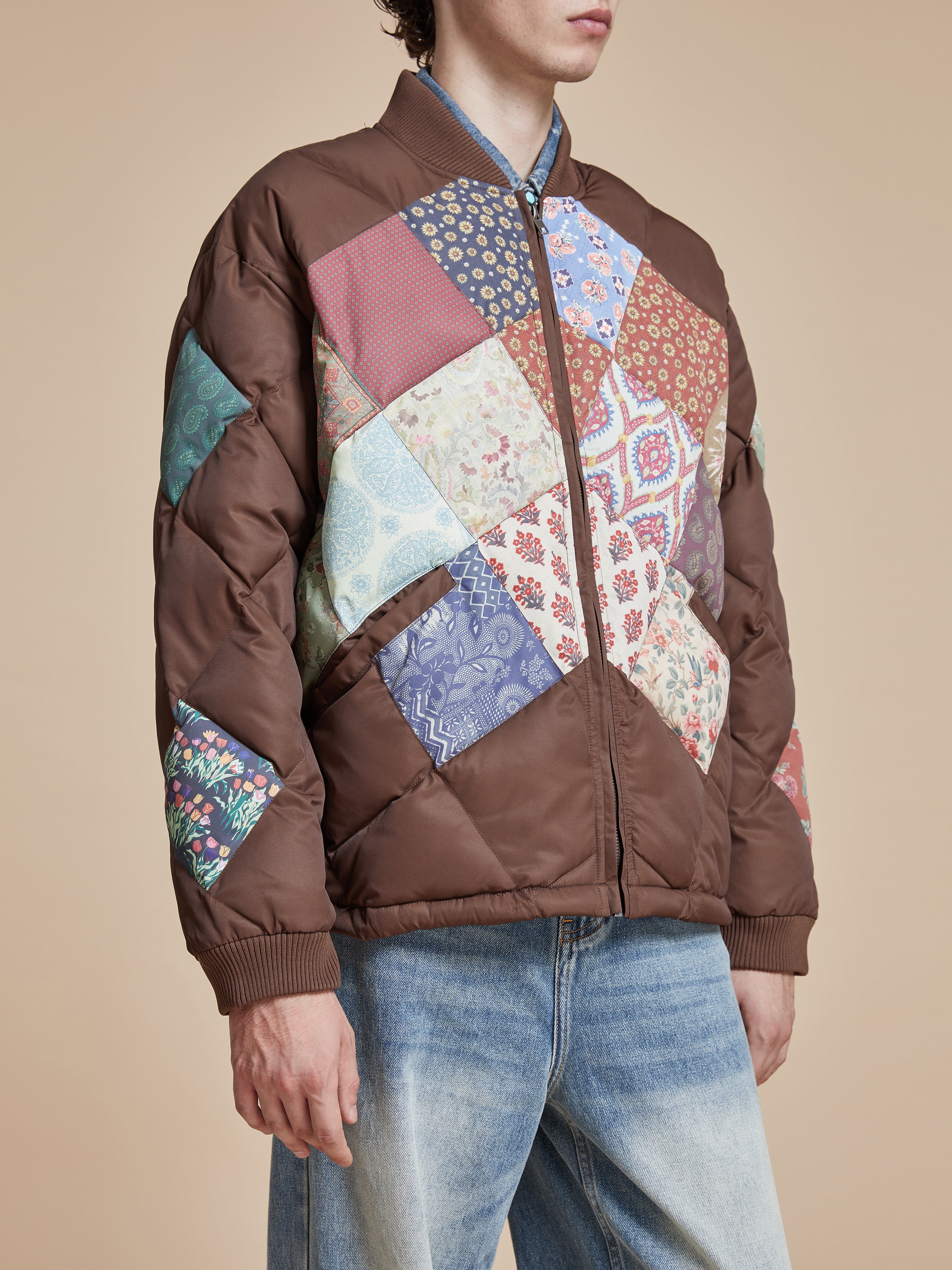 A man wearing a Found Diamond Quilt Patchwork Jacket.