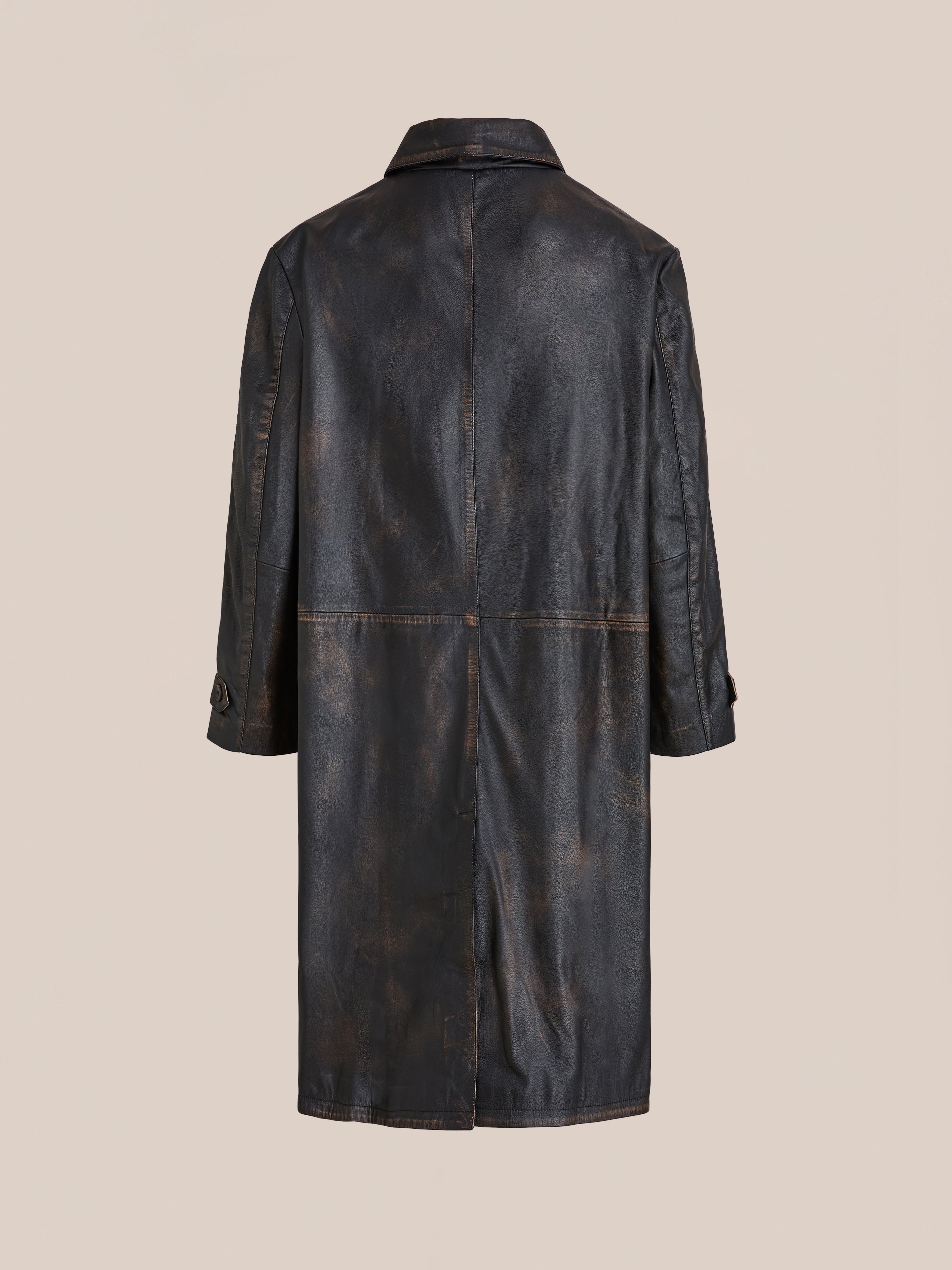 The FOUND Distressed Leather Trench Coat in dark brown features a collar and visible seams, displayed from the back against a plain beige background.