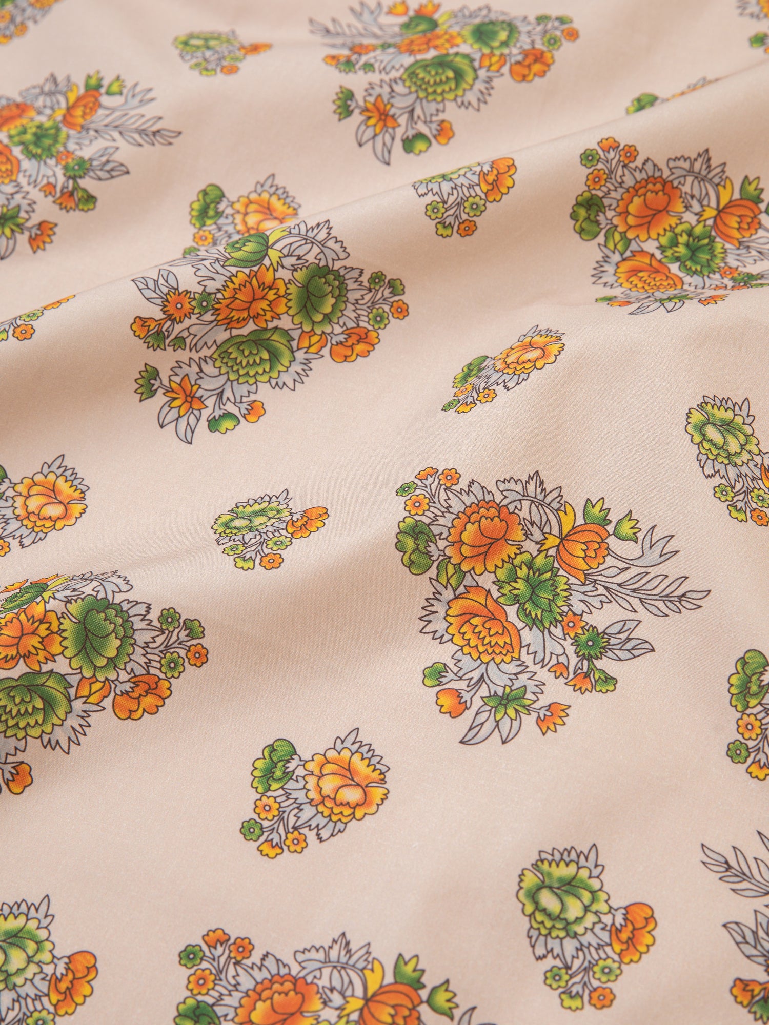 An orange and yellow Found Floral Print Bandana with motifs inspired by nature.