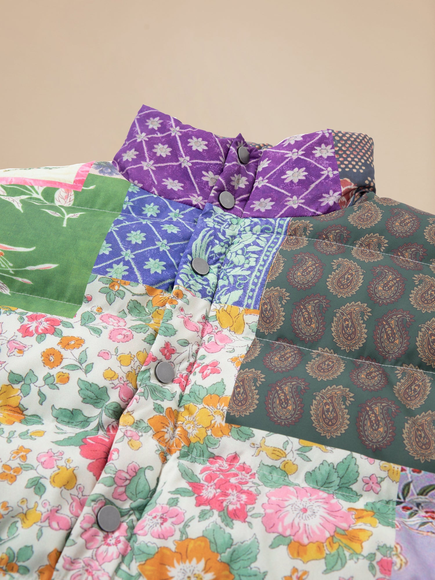 A pre-order Found Gardenia Tapestry Puffer Jacket featuring traditional South Asian prints.
