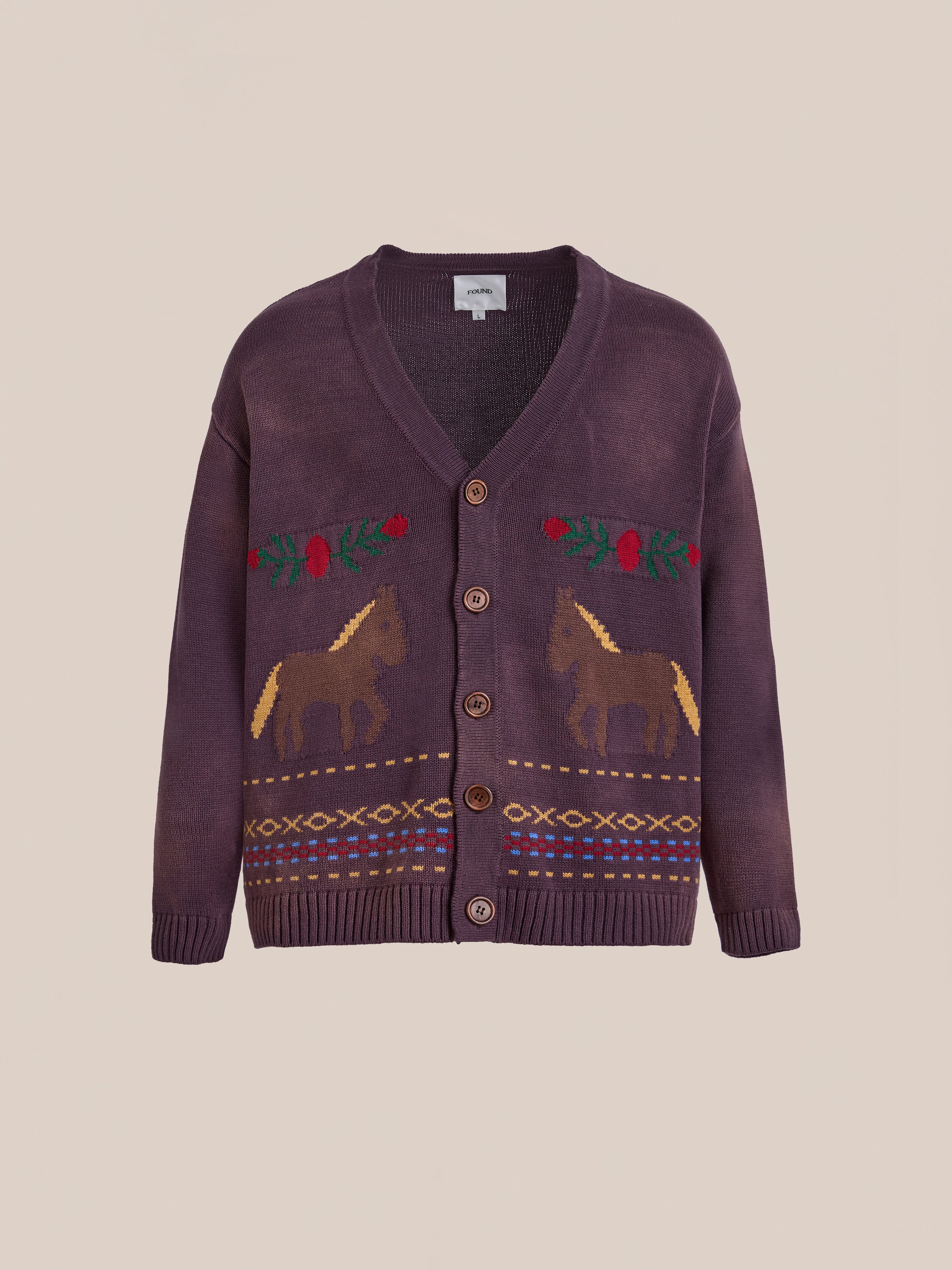 The Found Horse Jacquard Cardigan is a unisex knit button-up in dark purple, featuring a horse and foliage pattern with geometric designs along the hem and cuffs.