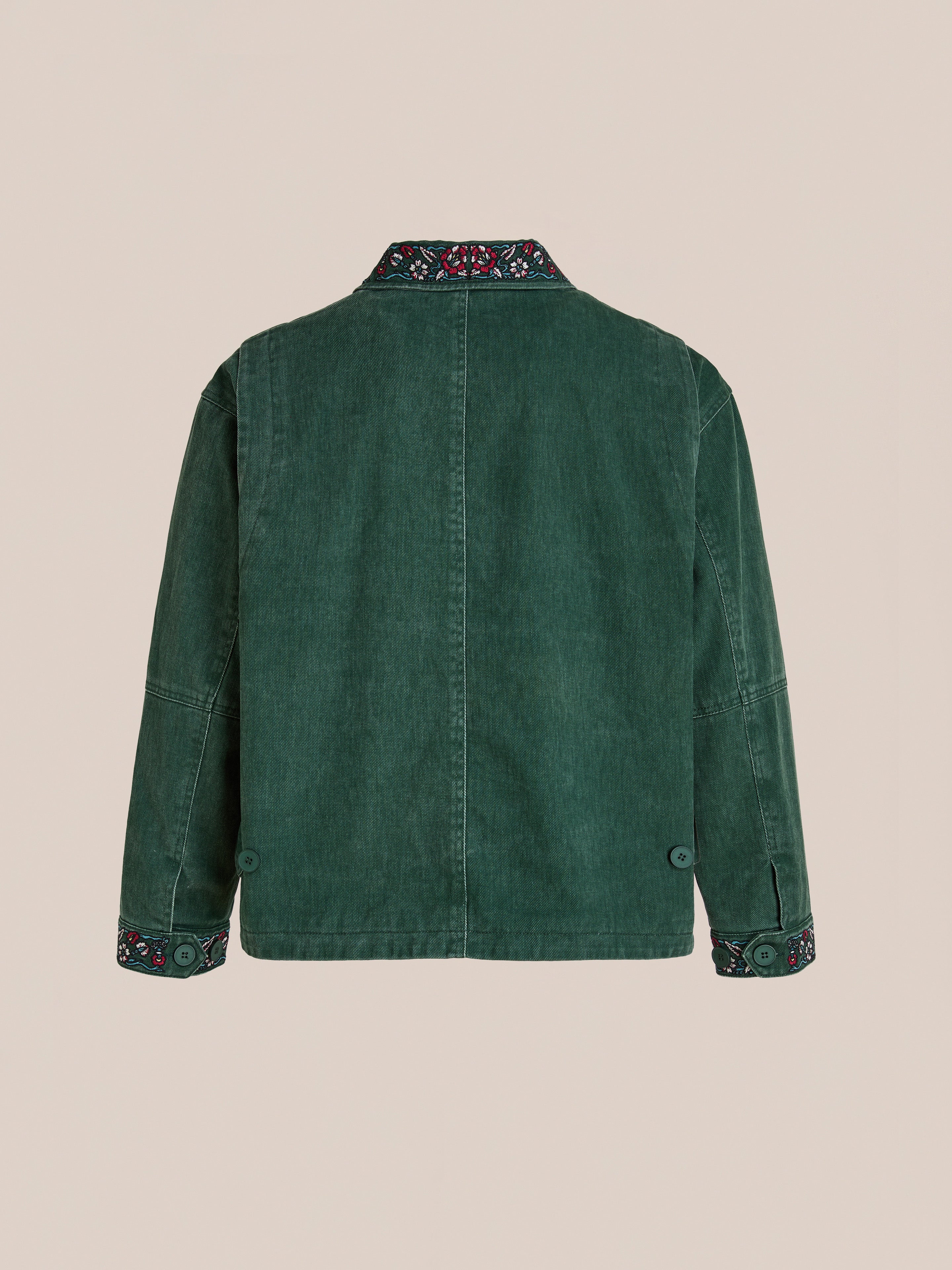Back view of the Found Jockey Club Embroidered Jacket in green denim, unisex relaxed fit, with racing horses embroidery on collar and cuffs, shown against a plain beige background.