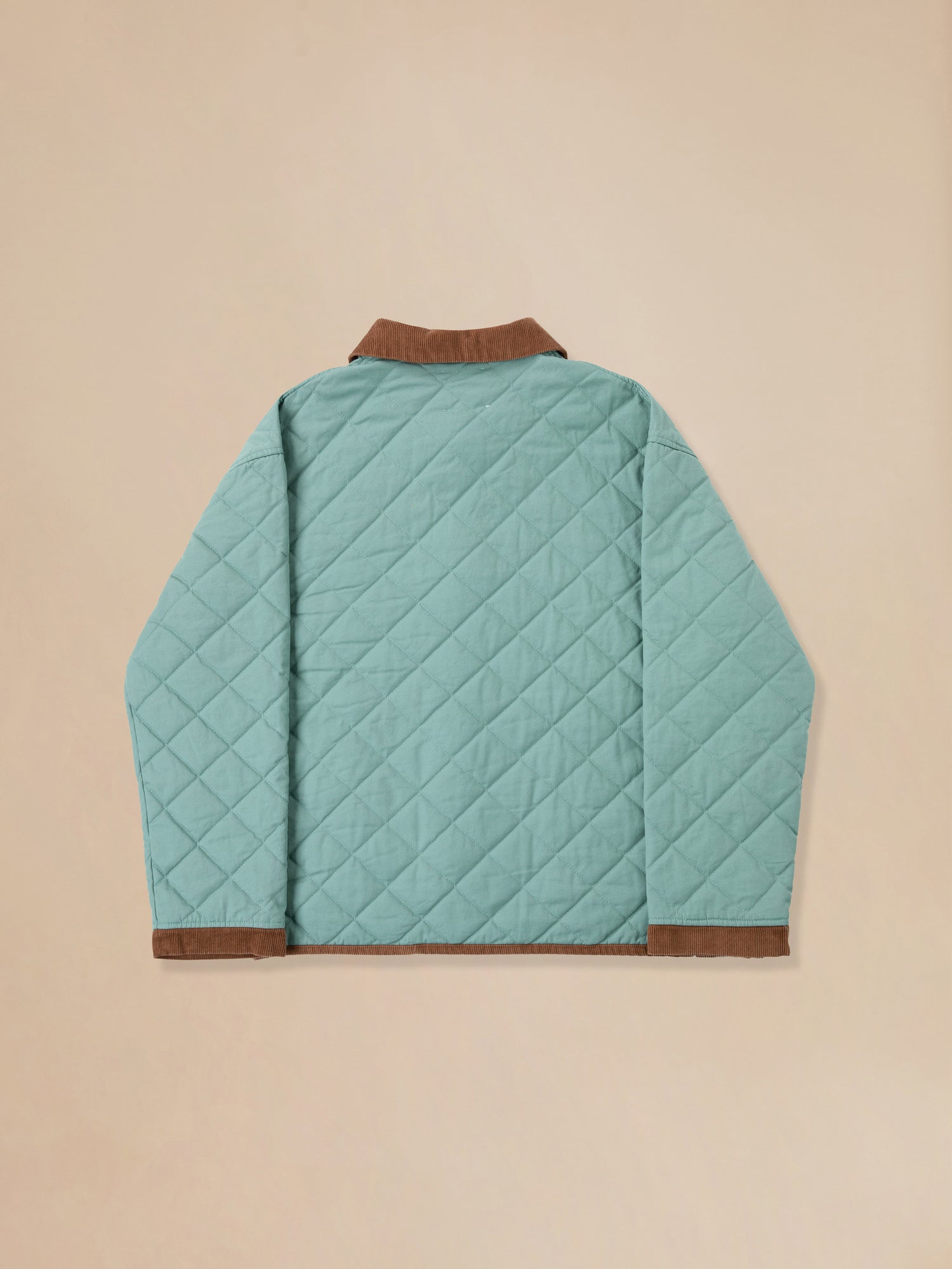 The back view of a Kashmir Meadow Quilt Jacket by Found.