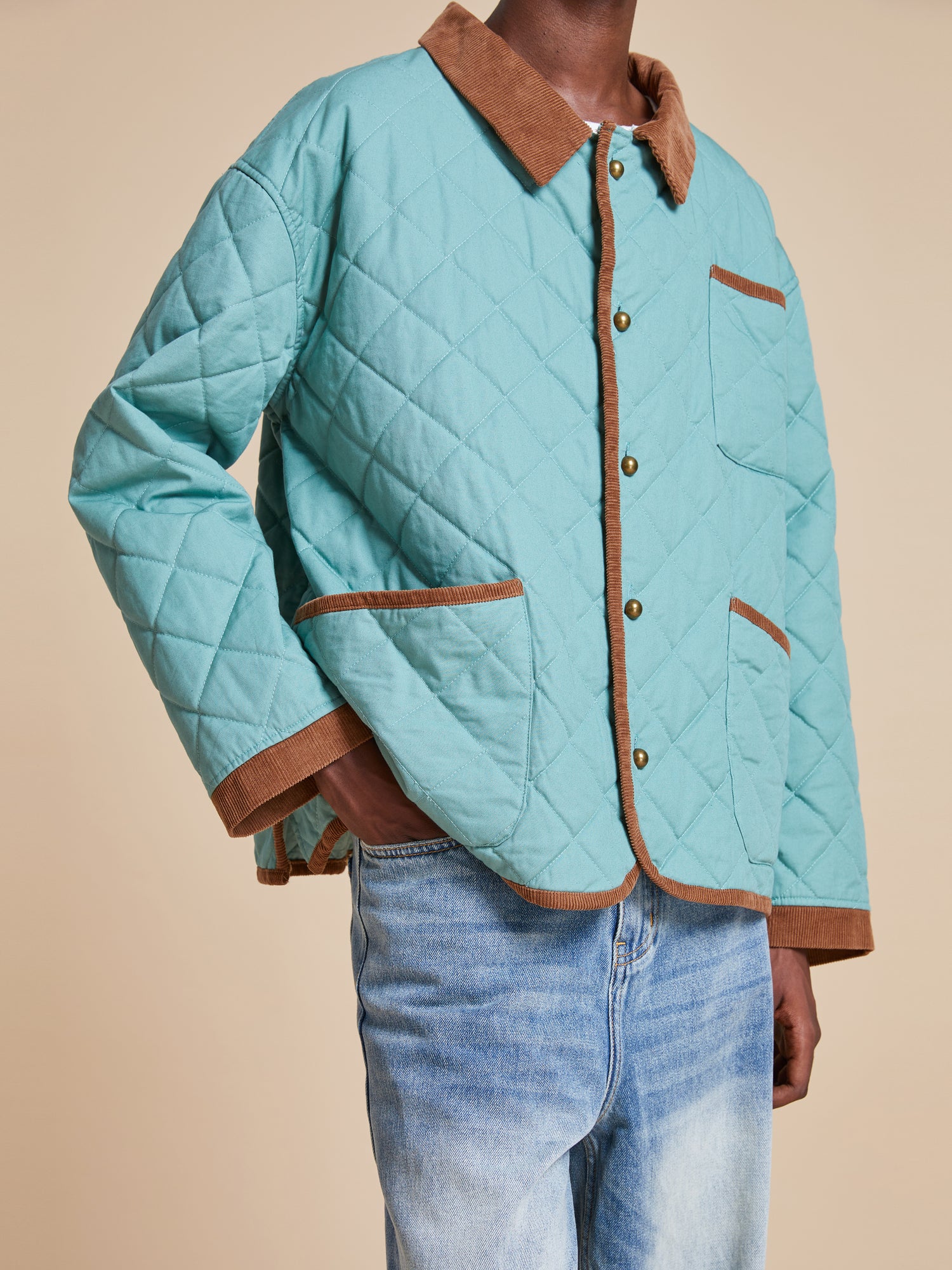 A man wearing a Kashmir Meadow Quilt Jacket by Found.