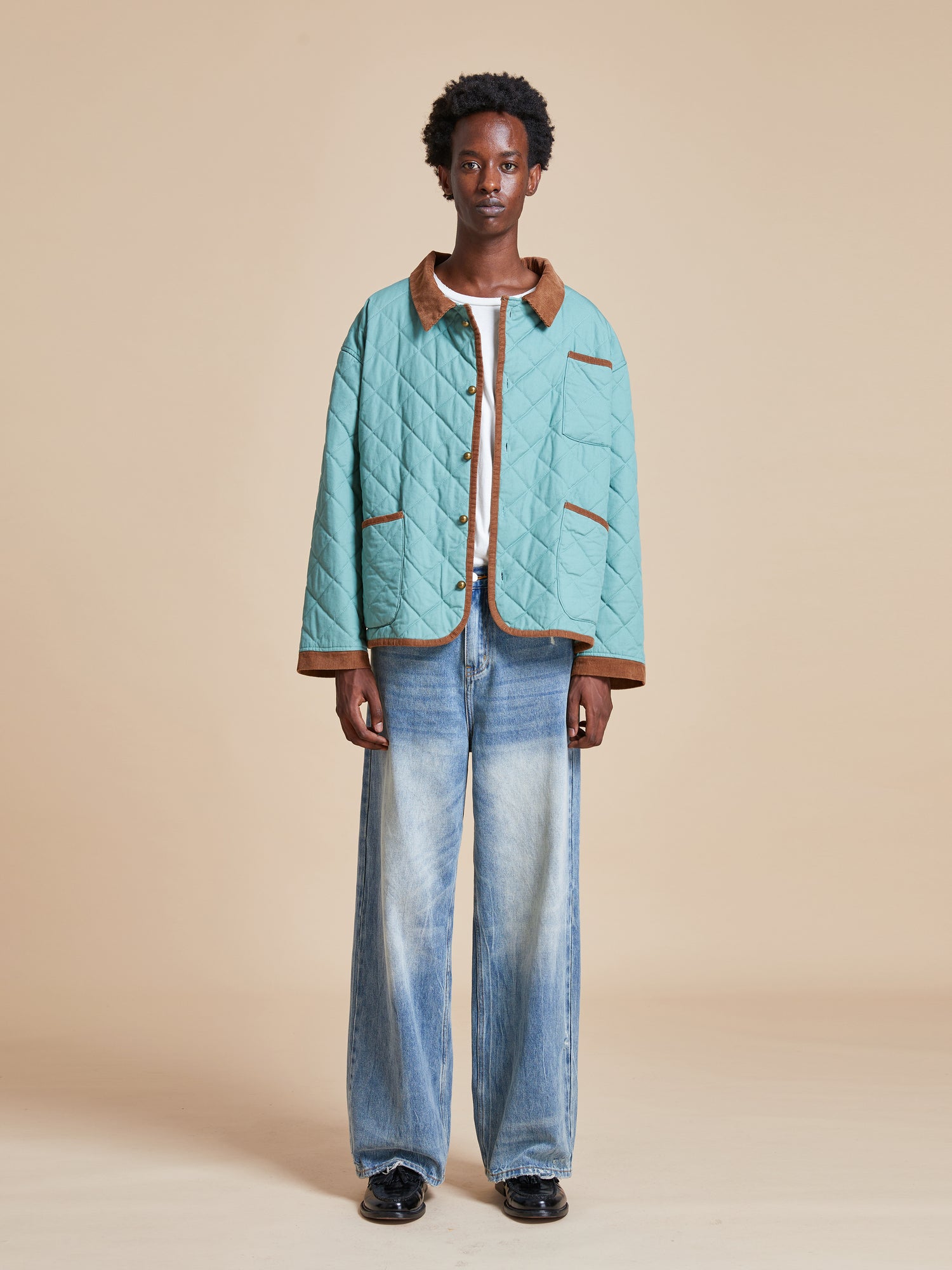 Male model wearing the Kashmir Meadow Quilt Jacket from Found's Fall 2023 collection
