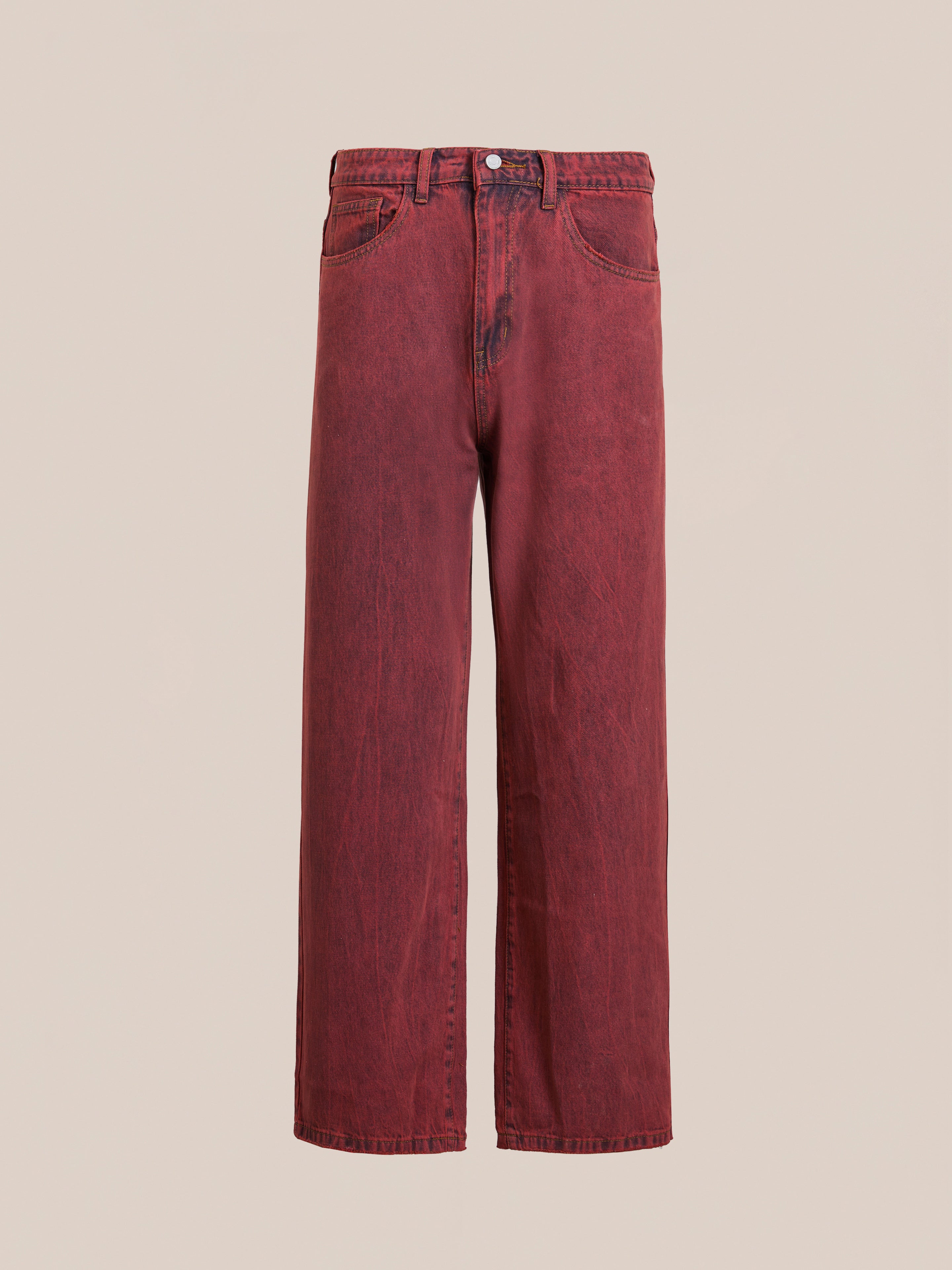 FOUND presents Lacy Baggy Jeans in vintage red wash with a button closure and front pockets. These unisex, wide-leg jeans offer timeless style, displayed against a plain backdrop.