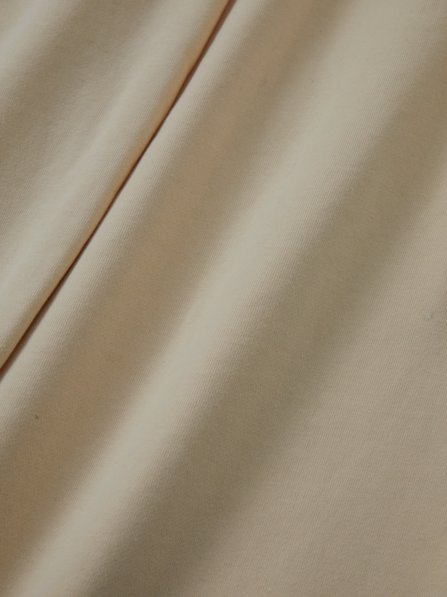 A close up of Found's Sandshell Lounge Pants, showcasing their worn-in look.