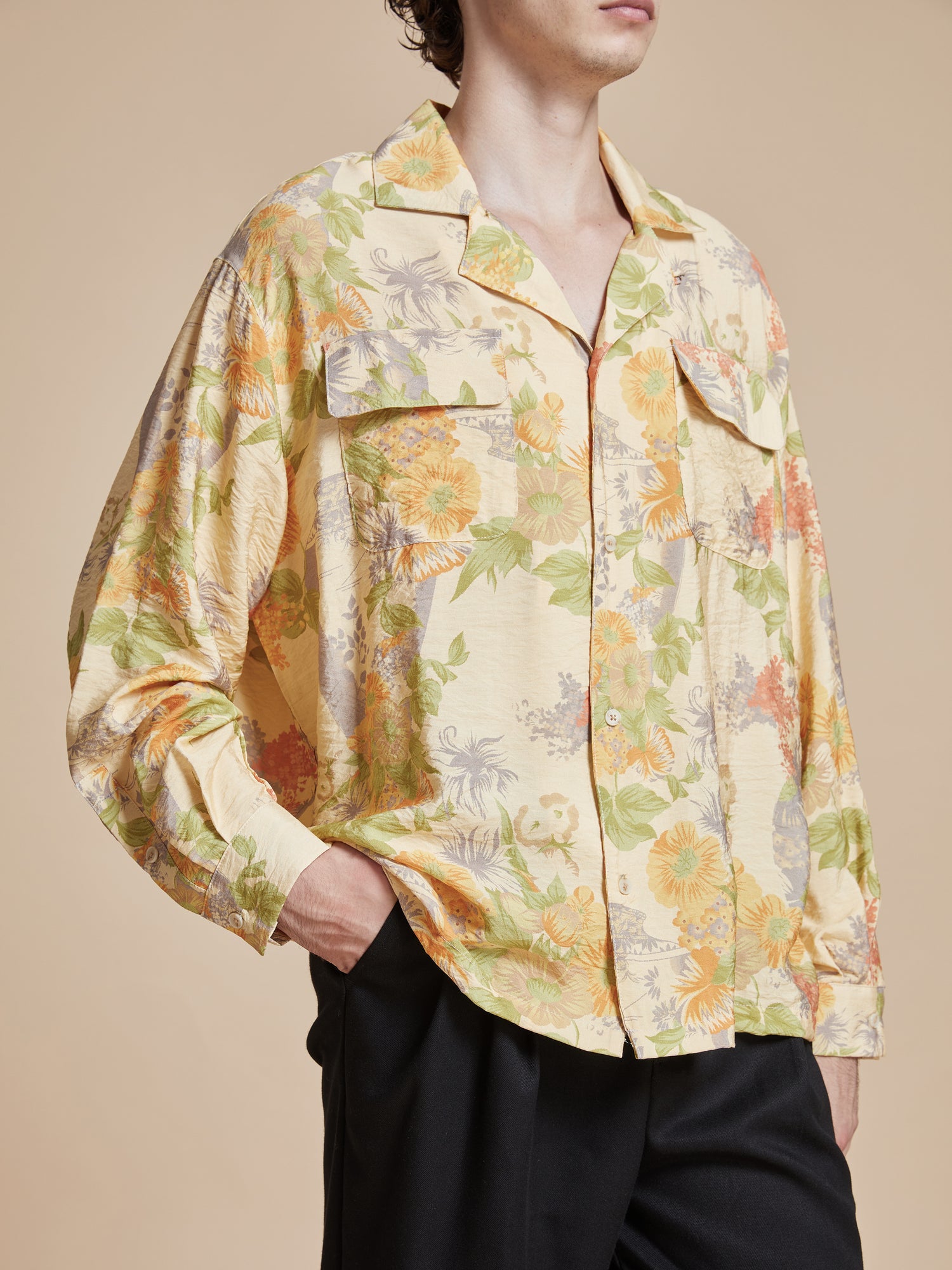 The Meraj Vase Pot Long Sleeve Camp Shirt by Found is adorned with vibrant yellow floral phulkari motifs inspired by nature.