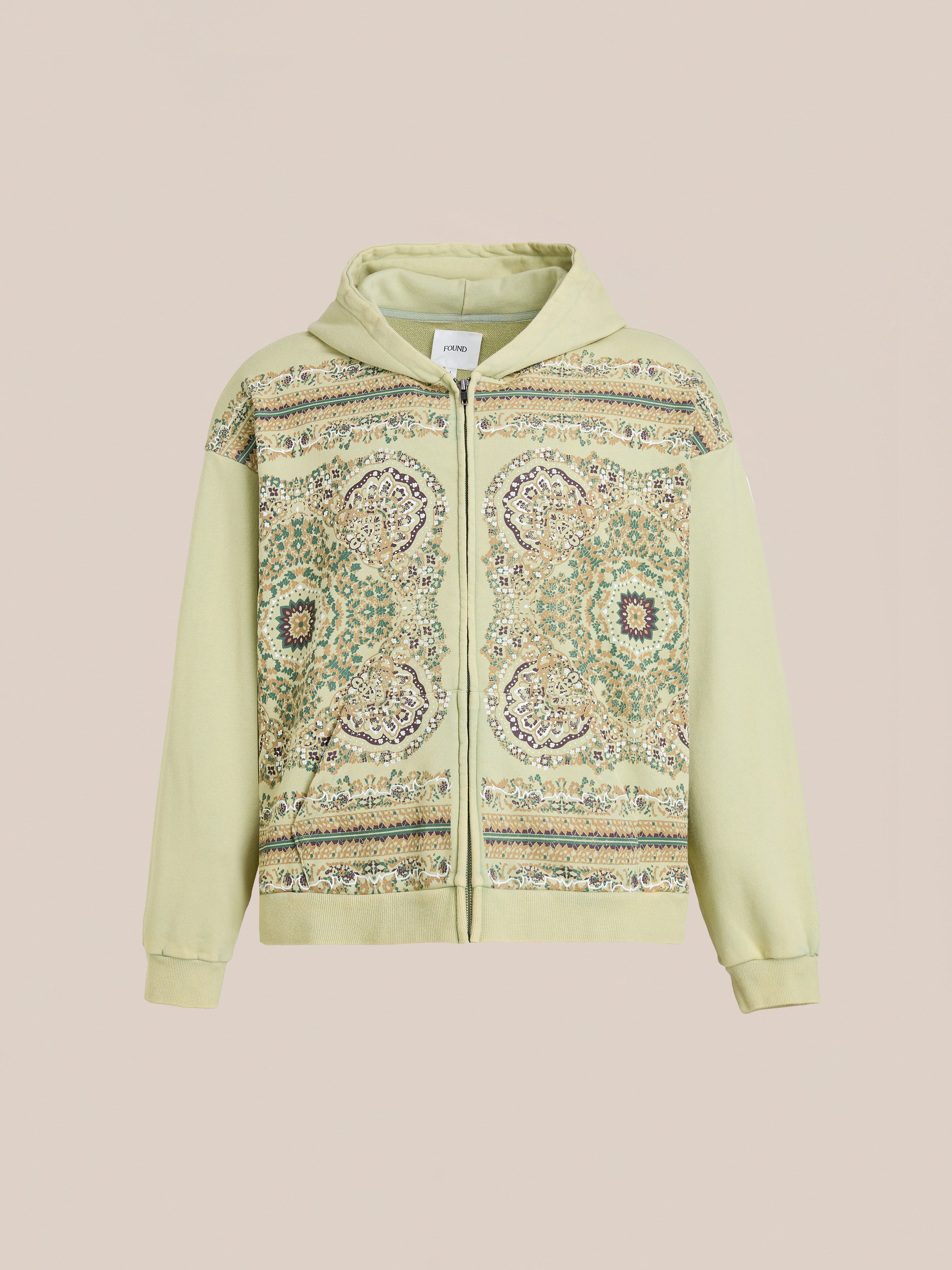 The FOUND Motif Zip-Up Hoodie in light green features a front panel with intricate multicolored geometric and floral mandala-inspired designs—a streetwear essential, showcased on a neutral background.