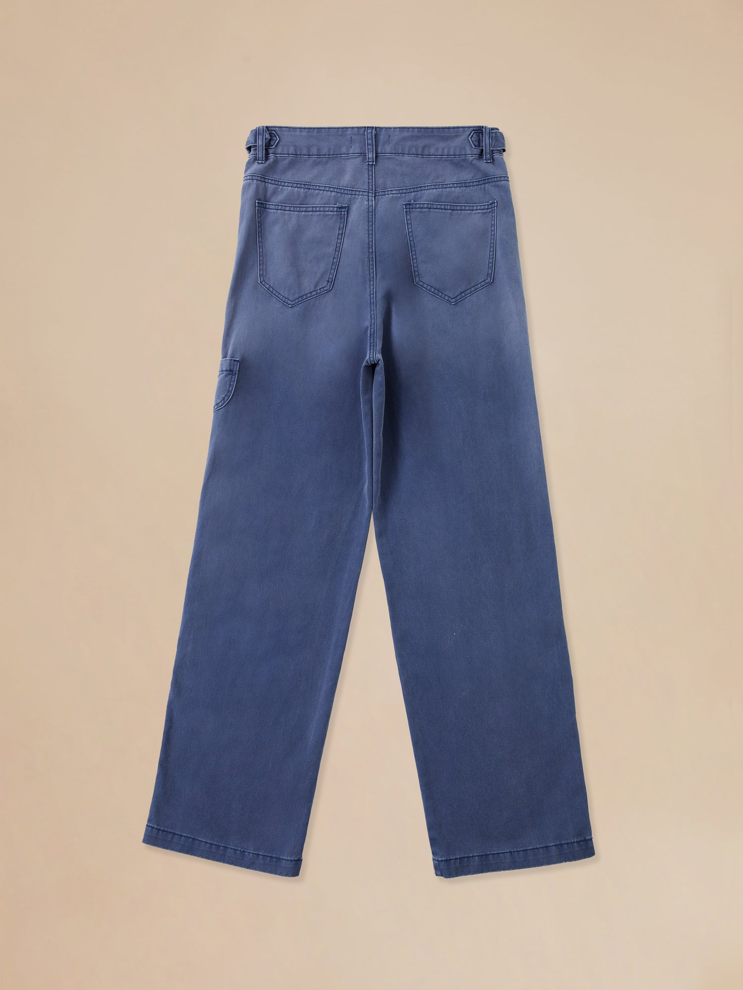 A child's River Painters Chore Pants with pockets on the back, made by Found.