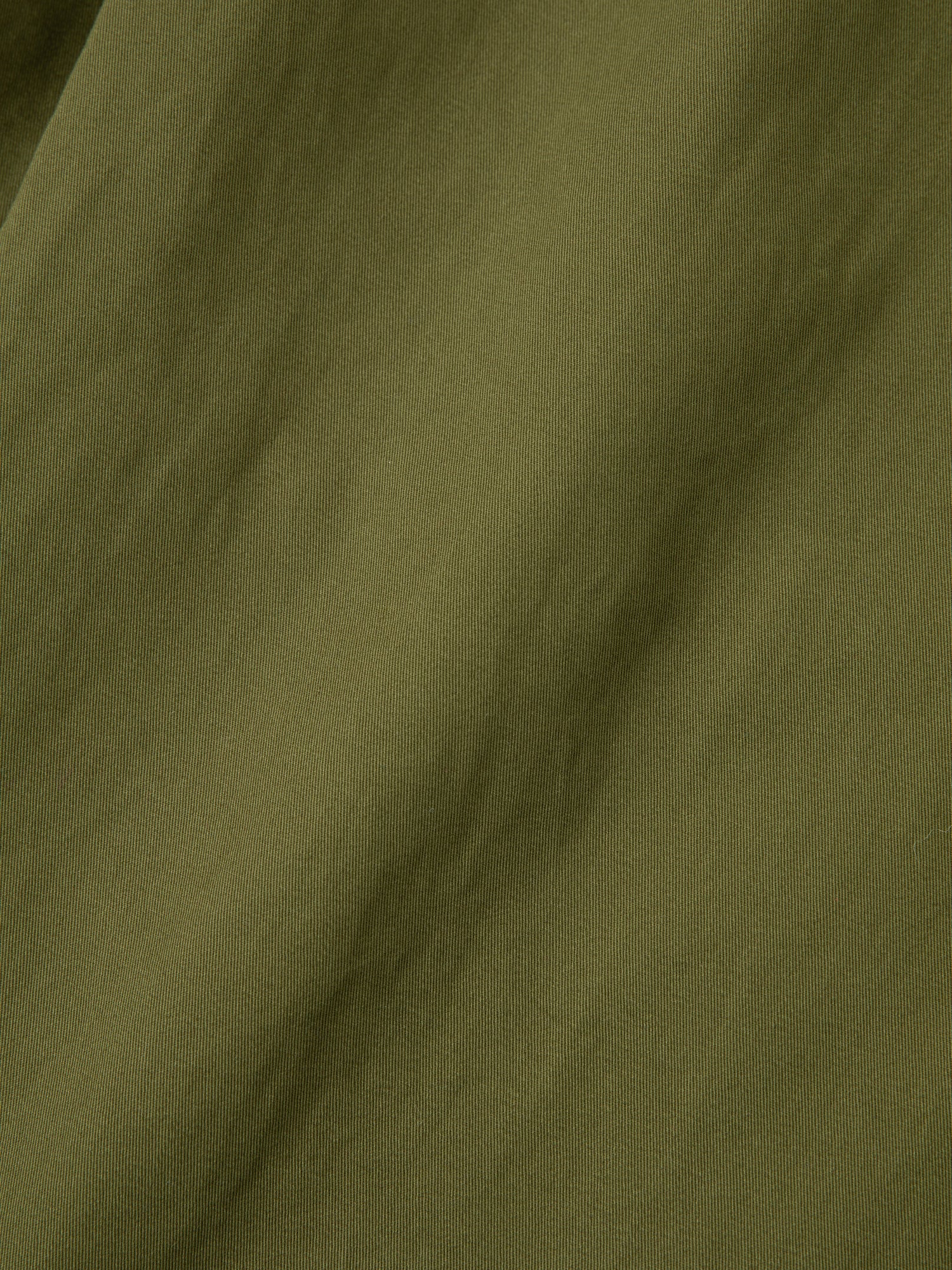 A close up image of Found Parachute Cargo Twill Pants in an olive green fabric.