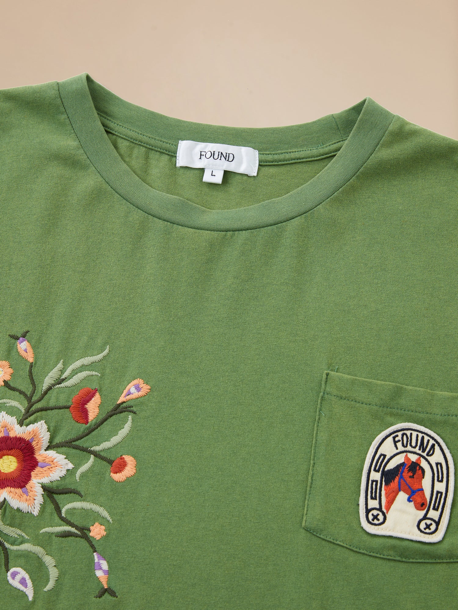 A Pine Needle Farm Tee from Found, with an embroidered pocket.