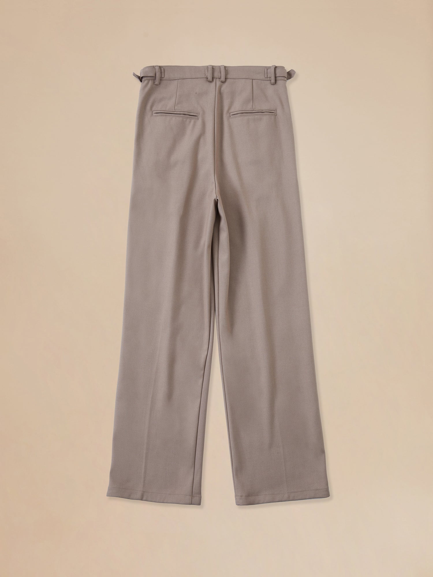 A pair of Found's Pleated Trousers in beige.