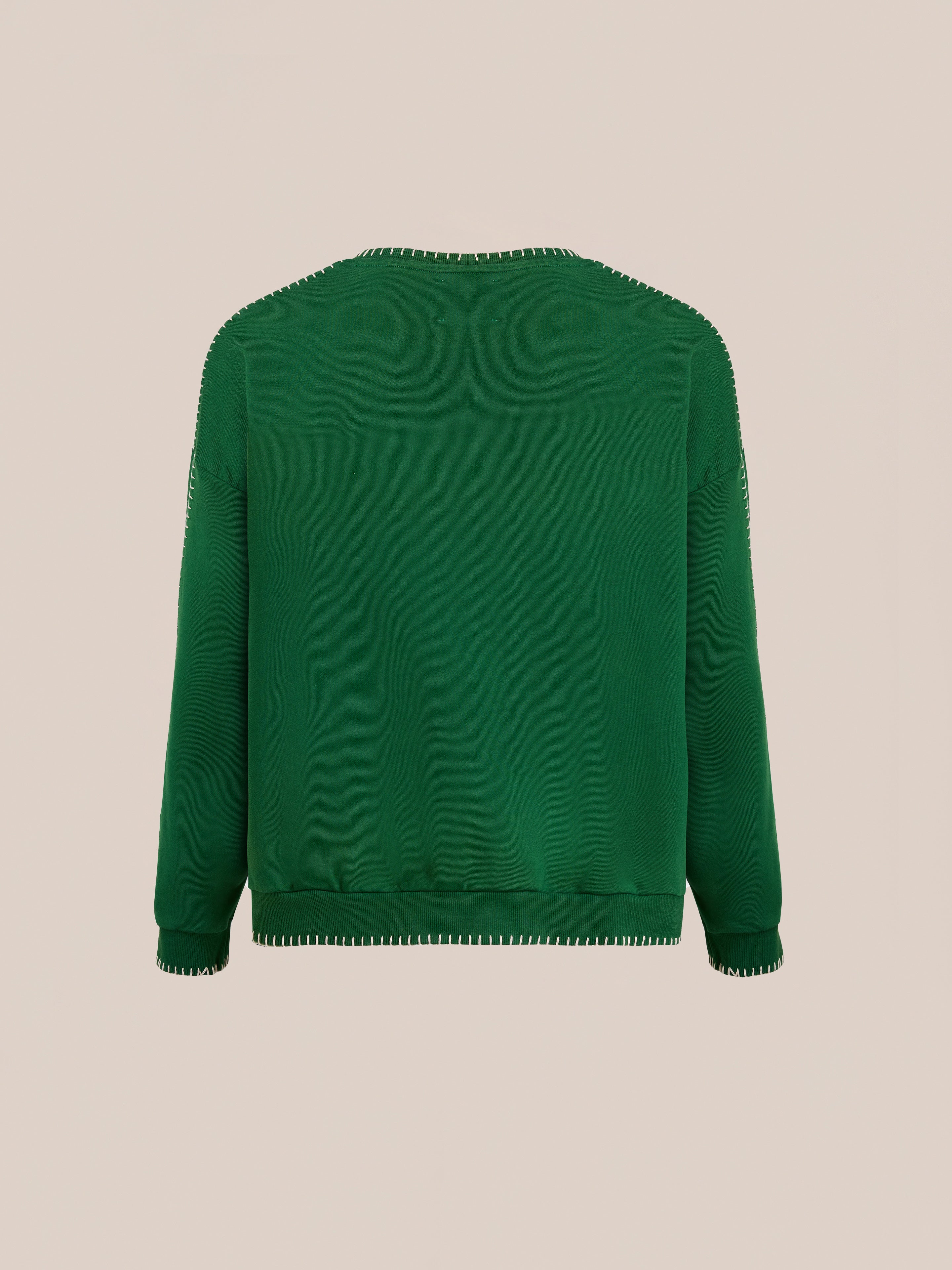 The FOUND Stitched Border Distressed Crewneck is a green vintage sweatshirt made from French terry cotton, with visible stitching on the neckline, cuffs, and hem, shown against a plain beige background.