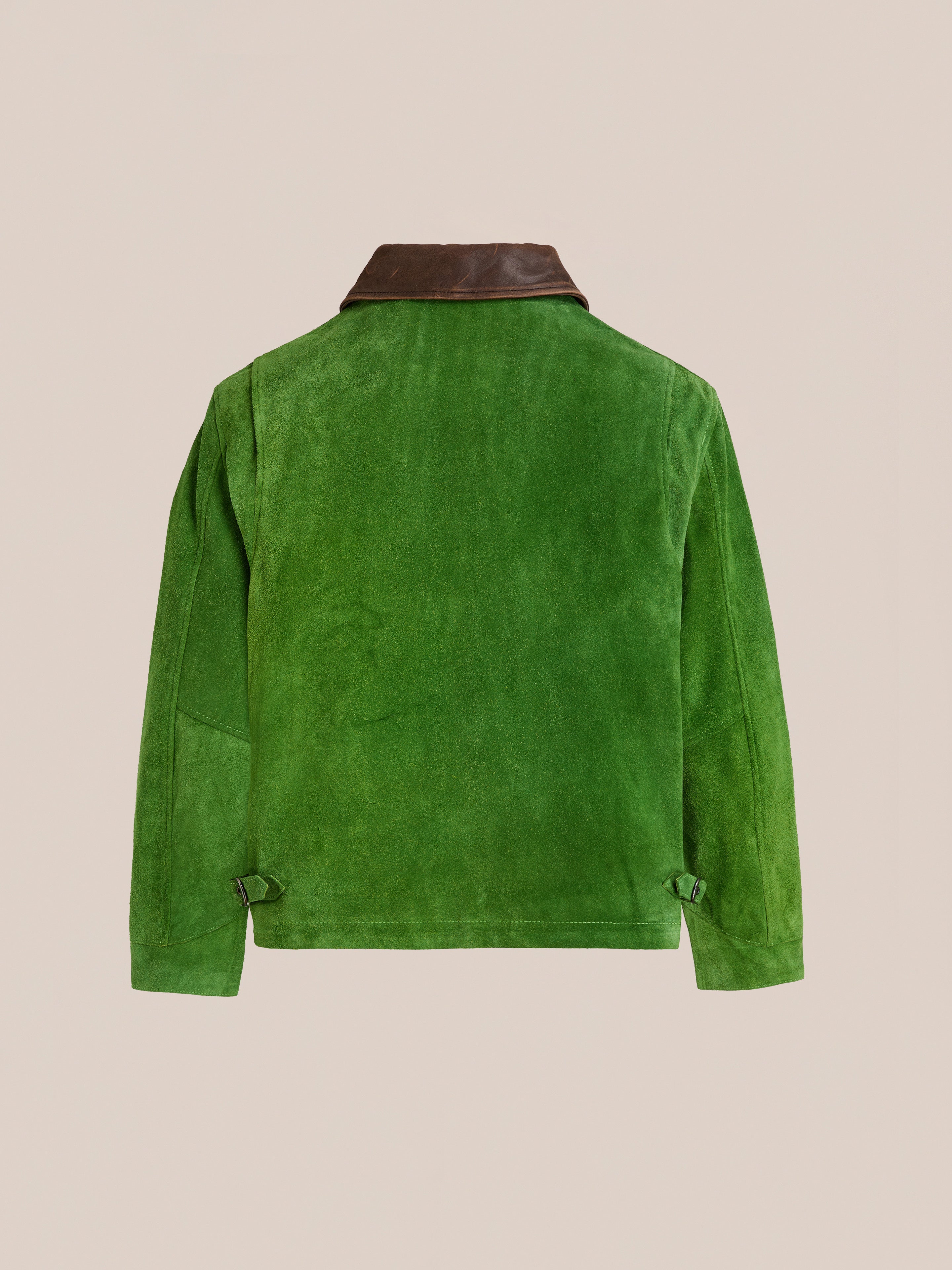 The FOUND Suede Western Barn Jacket features green suede leather with western yoke stitching and a dark brown collar, shown from the back against a plain beige background.
