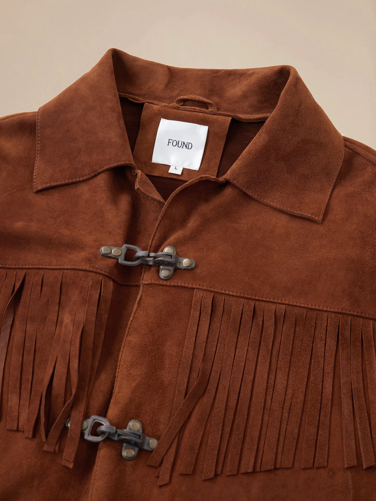 A Found Tobacco Fringe Suede Buckle Jacket.